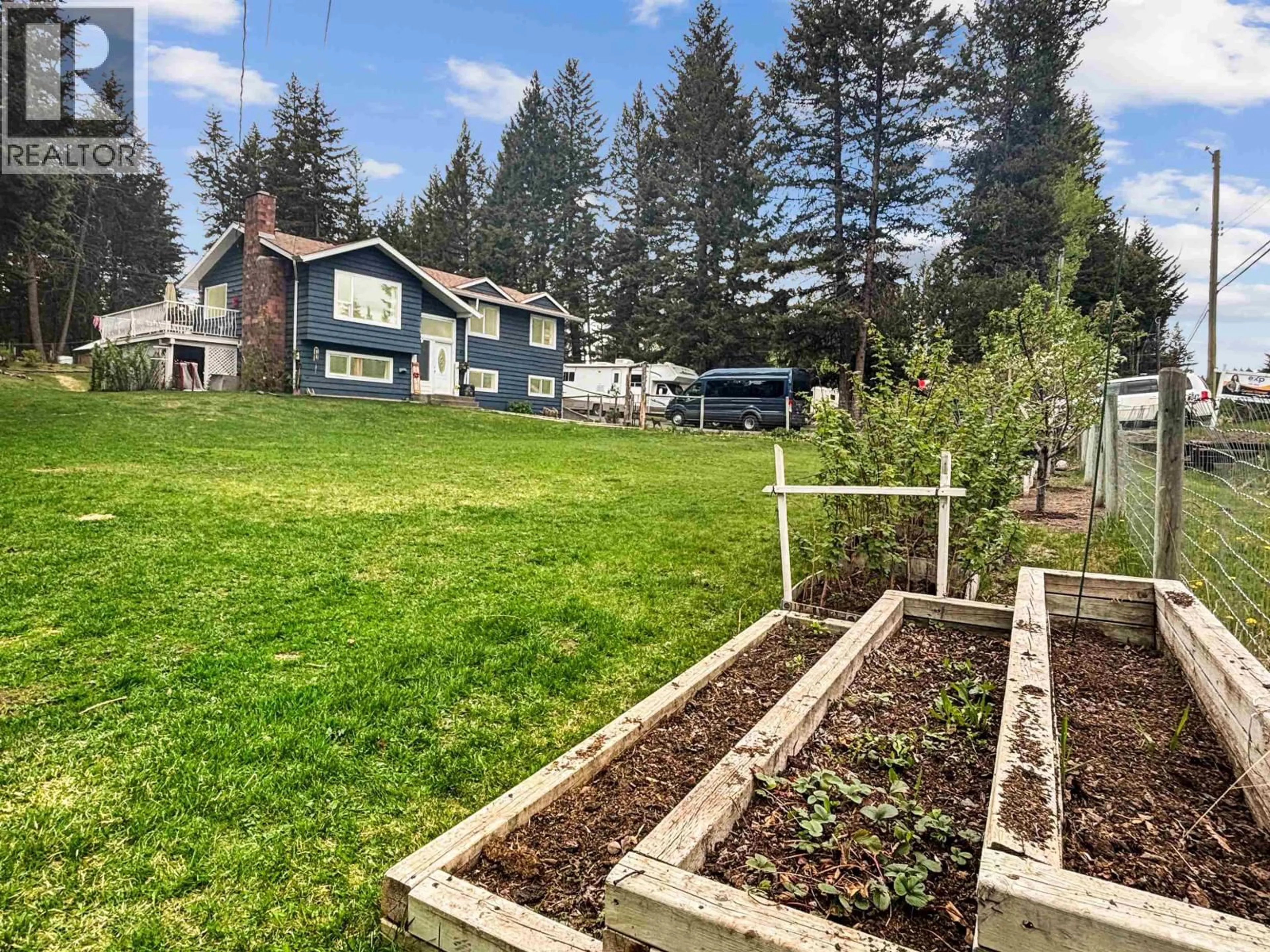 A pic from outside/outdoor area/front of a property/back of a property/a pic from drone, mountain view for 5047 EASZEE DRIVE, 108 Mile Ranch British Columbia V0K2Z0
