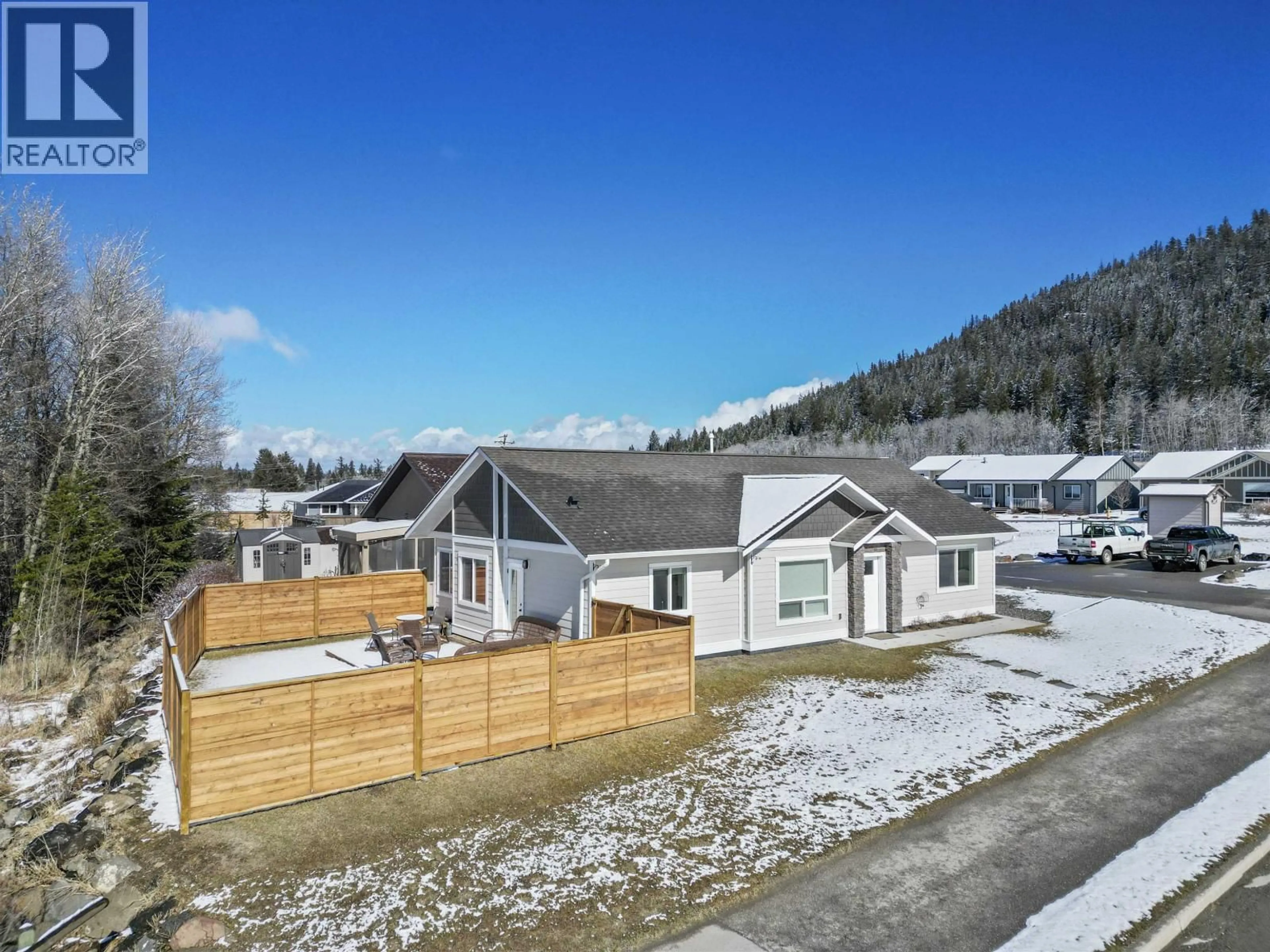 A pic from outside/outdoor area/front of a property/back of a property/a pic from drone, mountain view for 1 - 110 FOREST RIDGE ROAD, 100 Mile House British Columbia V0K2E1