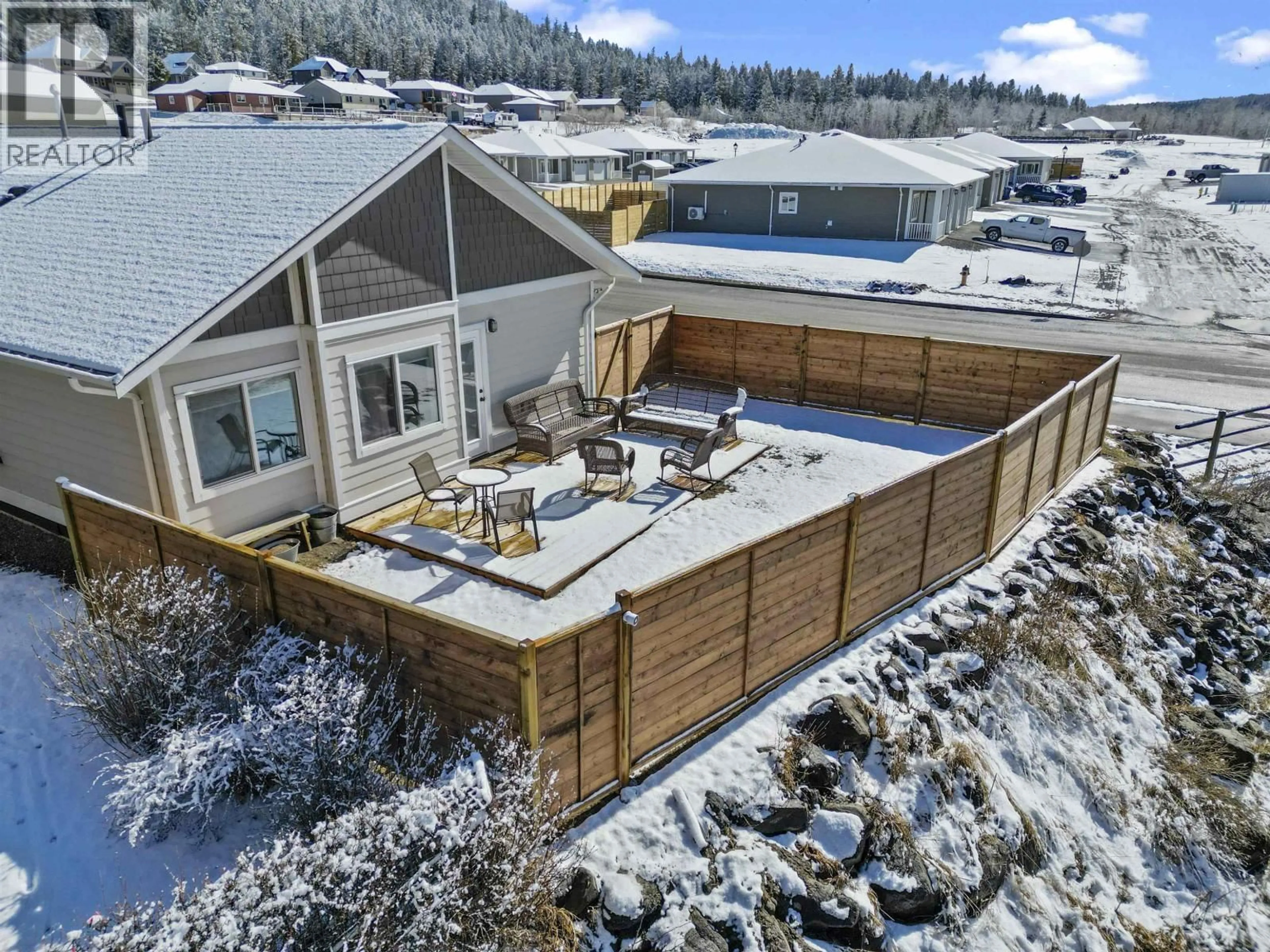 A pic from outside/outdoor area/front of a property/back of a property/a pic from drone, mountain view for 1 - 110 FOREST RIDGE ROAD, 100 Mile House British Columbia V0K2E1