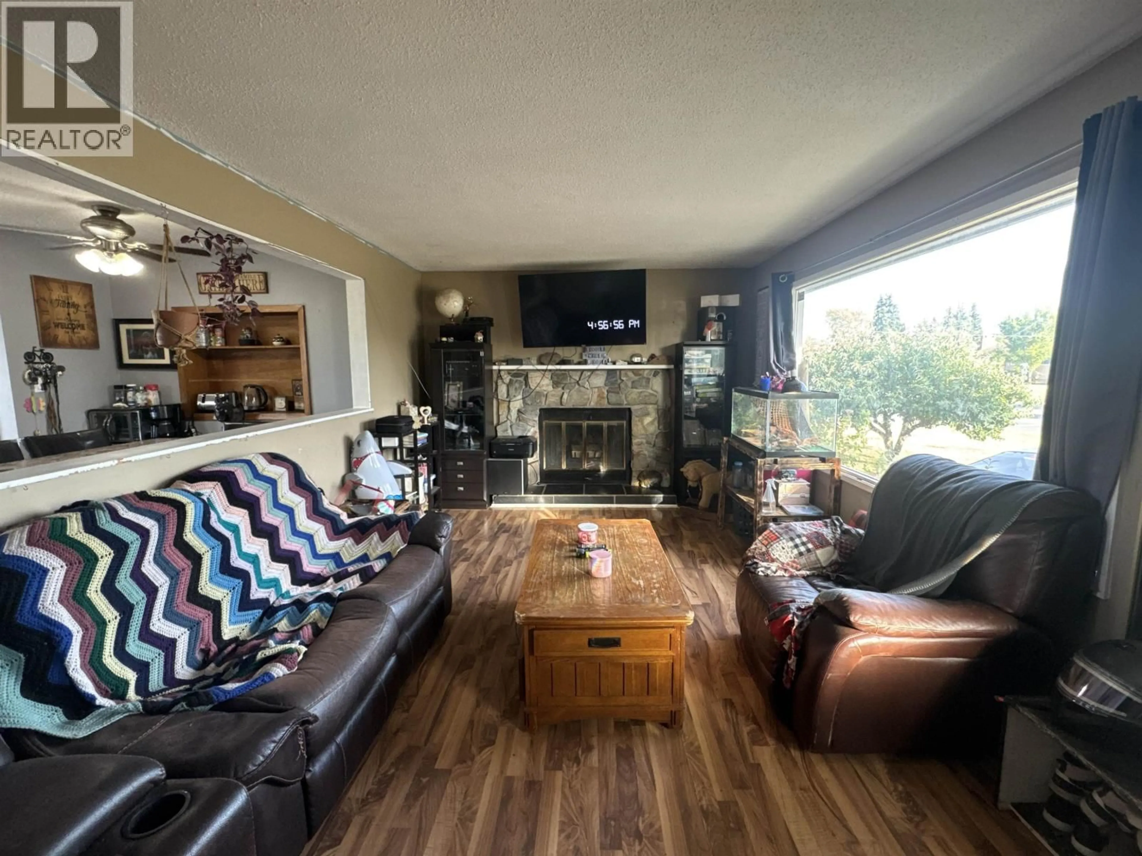 Living room with furniture, wood/laminate floor for 9808 112 AVENUE, Fort St. John British Columbia V1J2W5