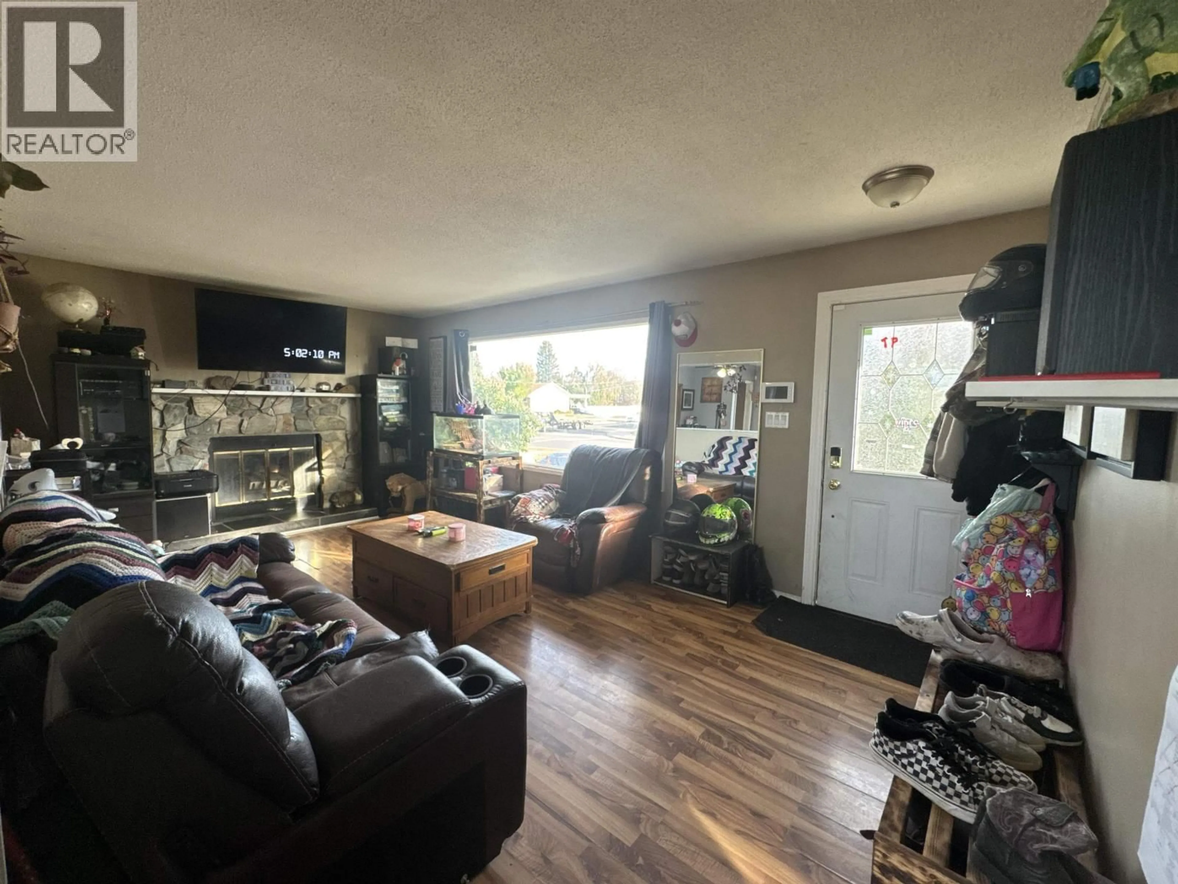 Living room with furniture, wood/laminate floor for 9808 112 AVENUE, Fort St. John British Columbia V1J2W5