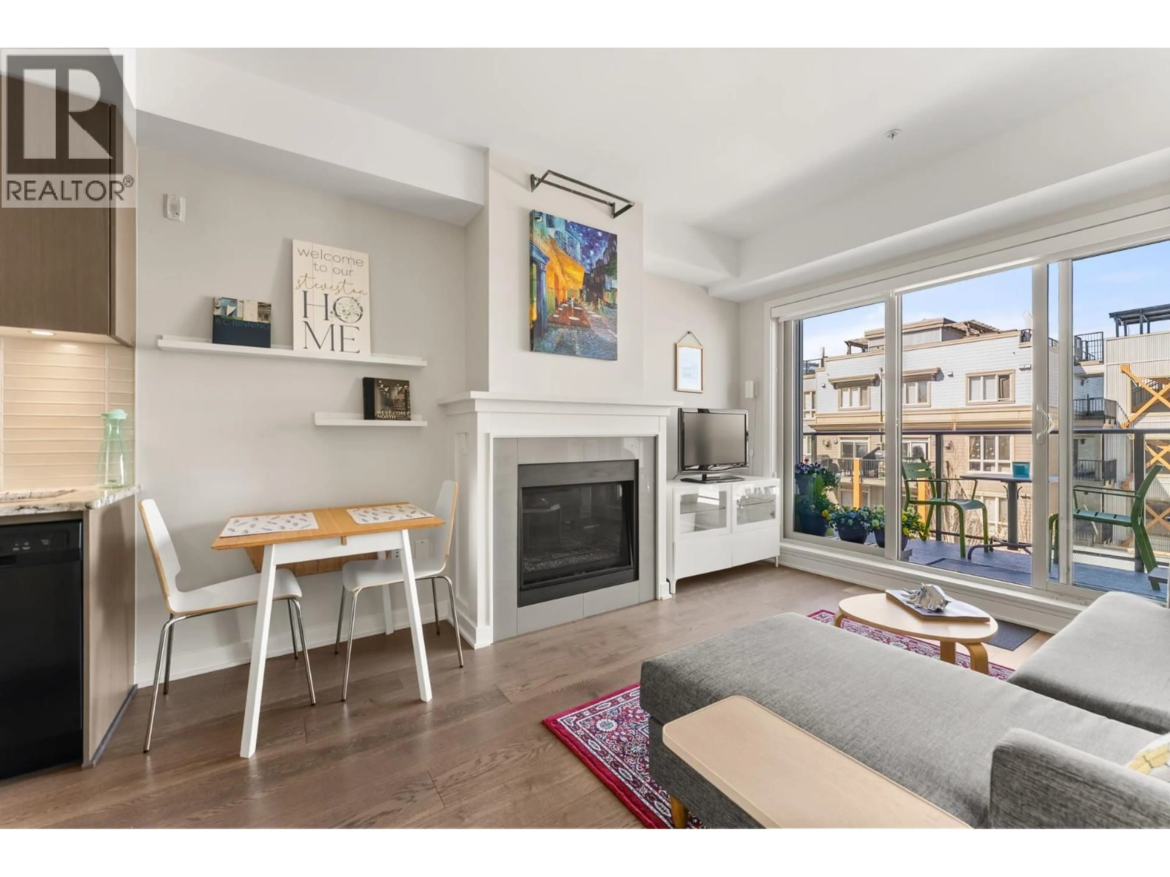 Living room with furniture, wood/laminate floor for 302 - 6168 LONDON ROAD, Richmond British Columbia V7E4J2