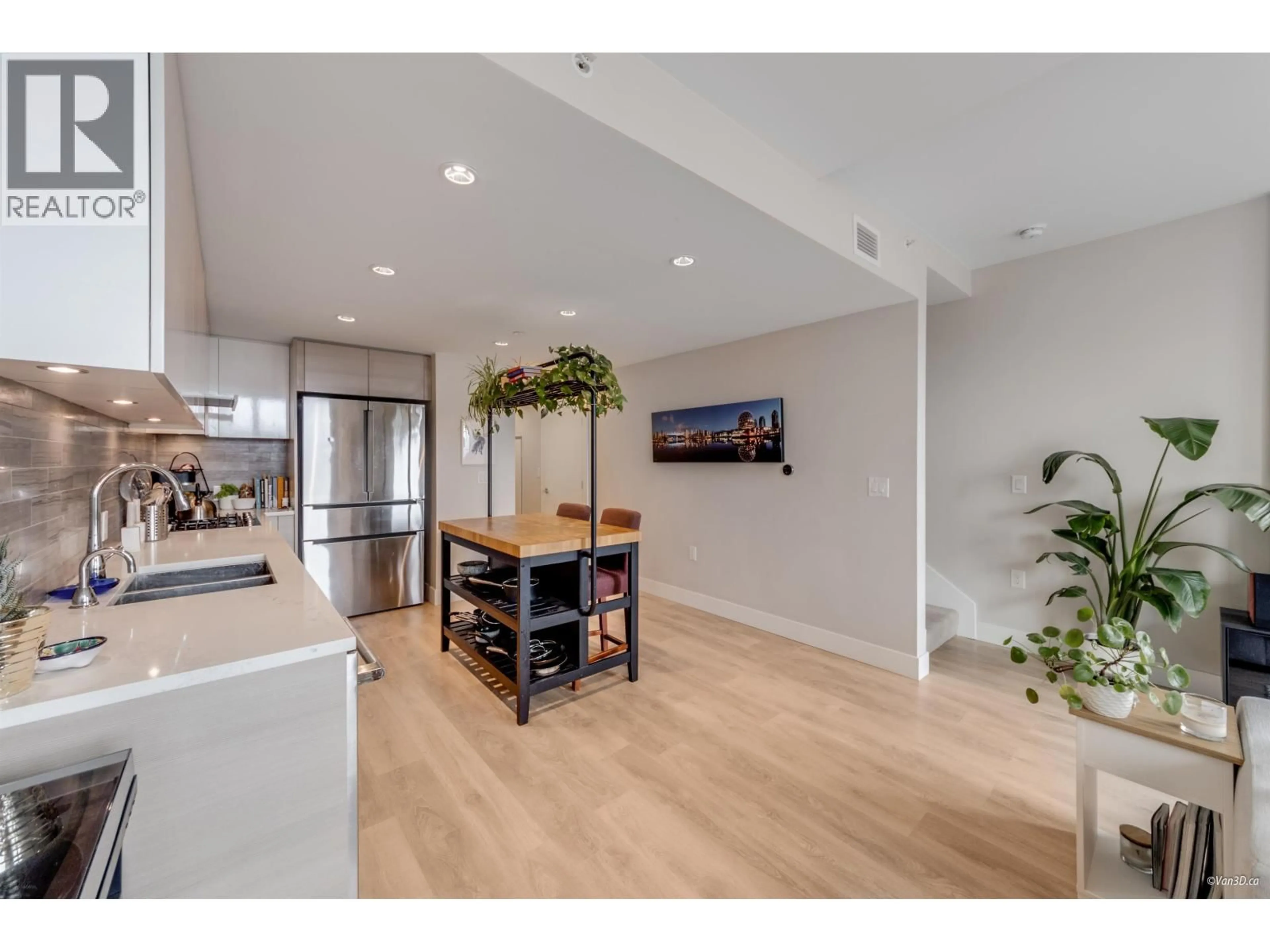 Open concept kitchen, wood/laminate floor for 505 - 3451 SAWMILL CRESCENT, Vancouver British Columbia V5S0H3