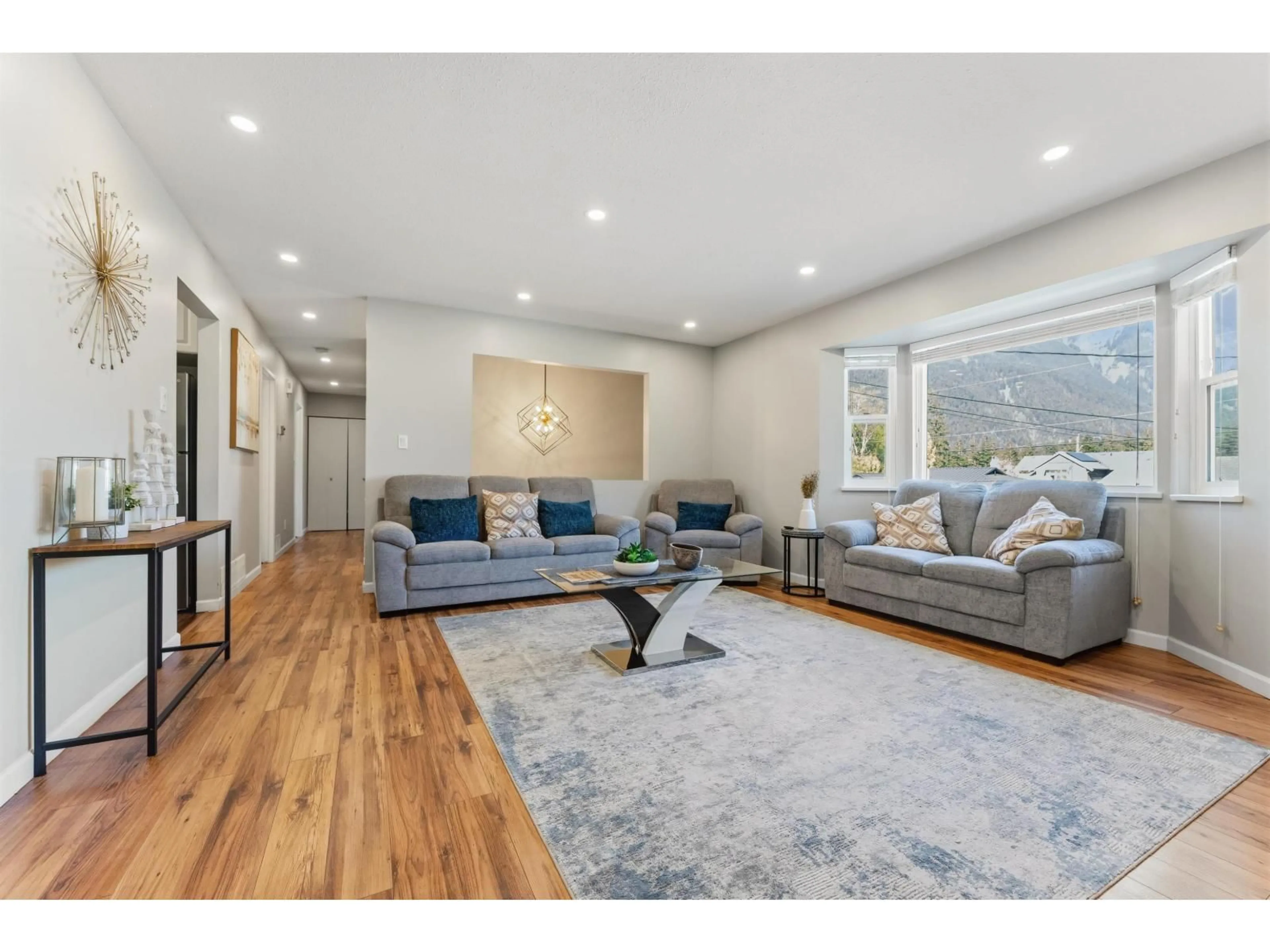 Living room with furniture, wood/laminate floor for 21015 SWALLOW PLACE, Hope British Columbia V0X1L1