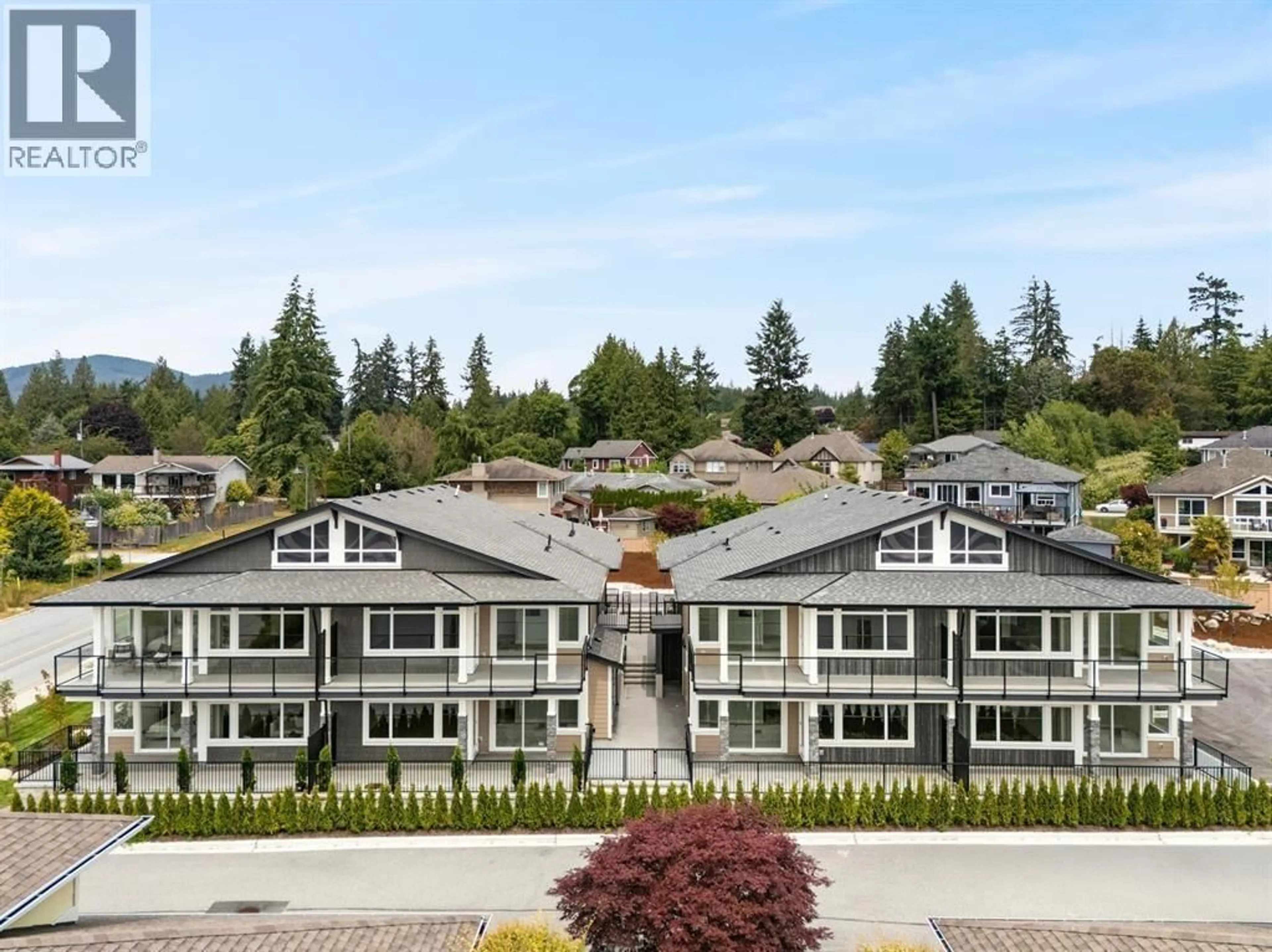 A pic from outside/outdoor area/front of a property/back of a property/a pic from drone, mountain view for 5 - 5522 MCCOURT ROAD, Sechelt British Columbia V0N3A7