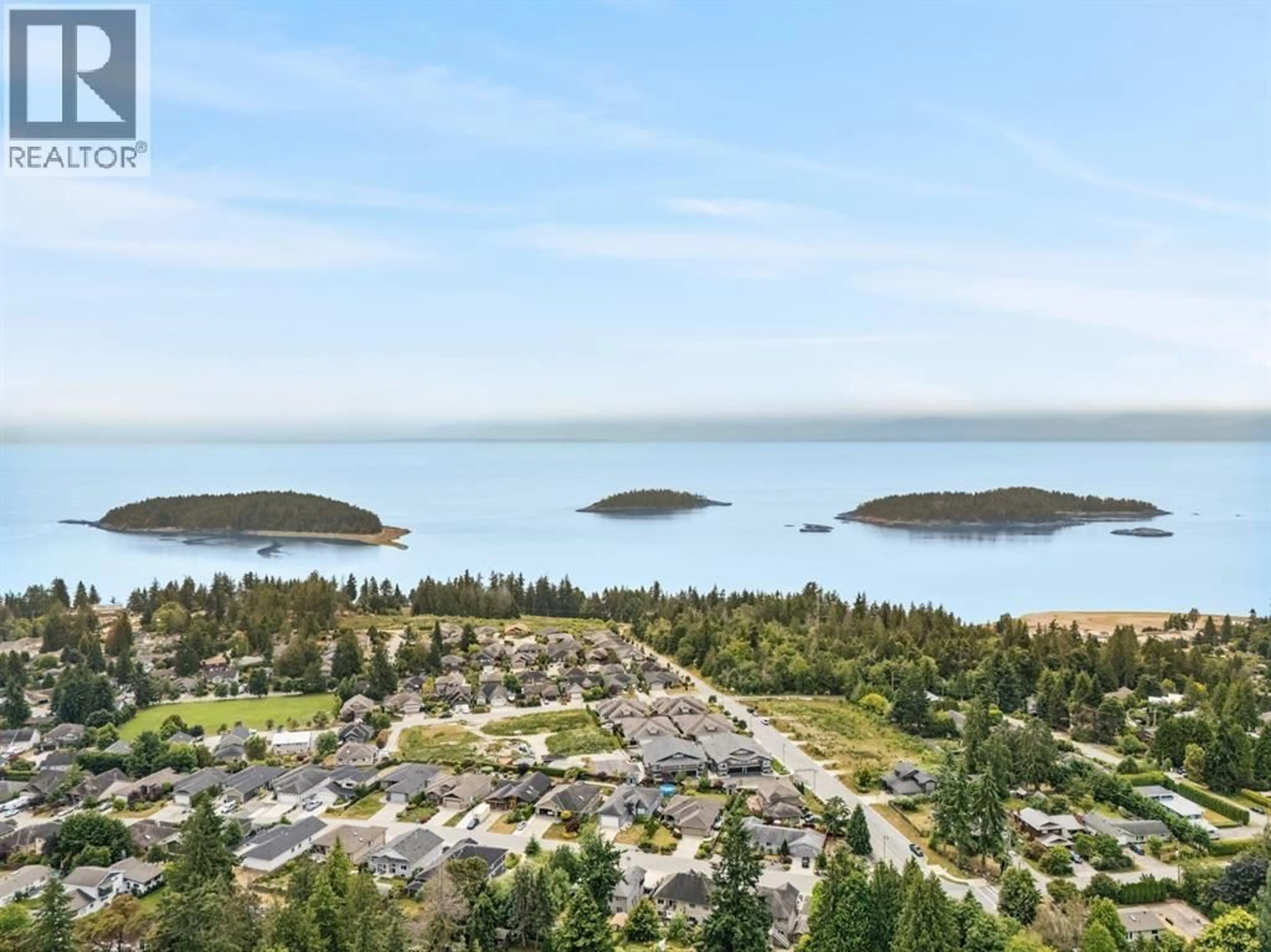 A pic from outside/outdoor area/front of a property/back of a property/a pic from drone, water/lake/river/ocean view for 5 - 5522 MCCOURT ROAD, Sechelt British Columbia V0N3A7