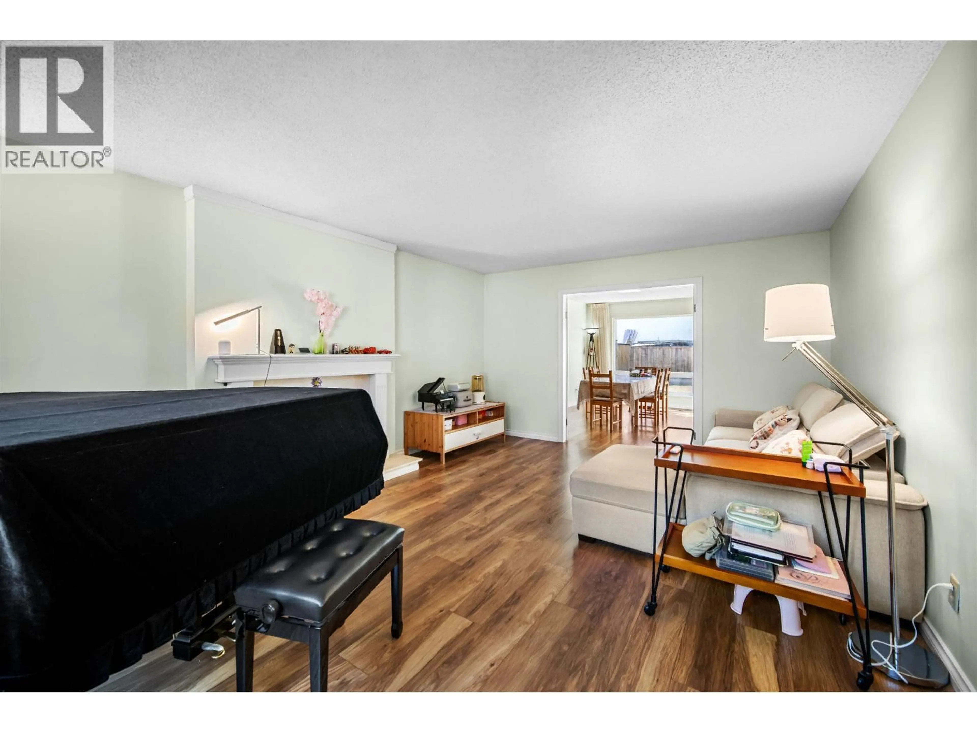 Living room with furniture, wood/laminate floor for 4340 TIFFIN CRESCENT, Richmond British Columbia V7C4X8