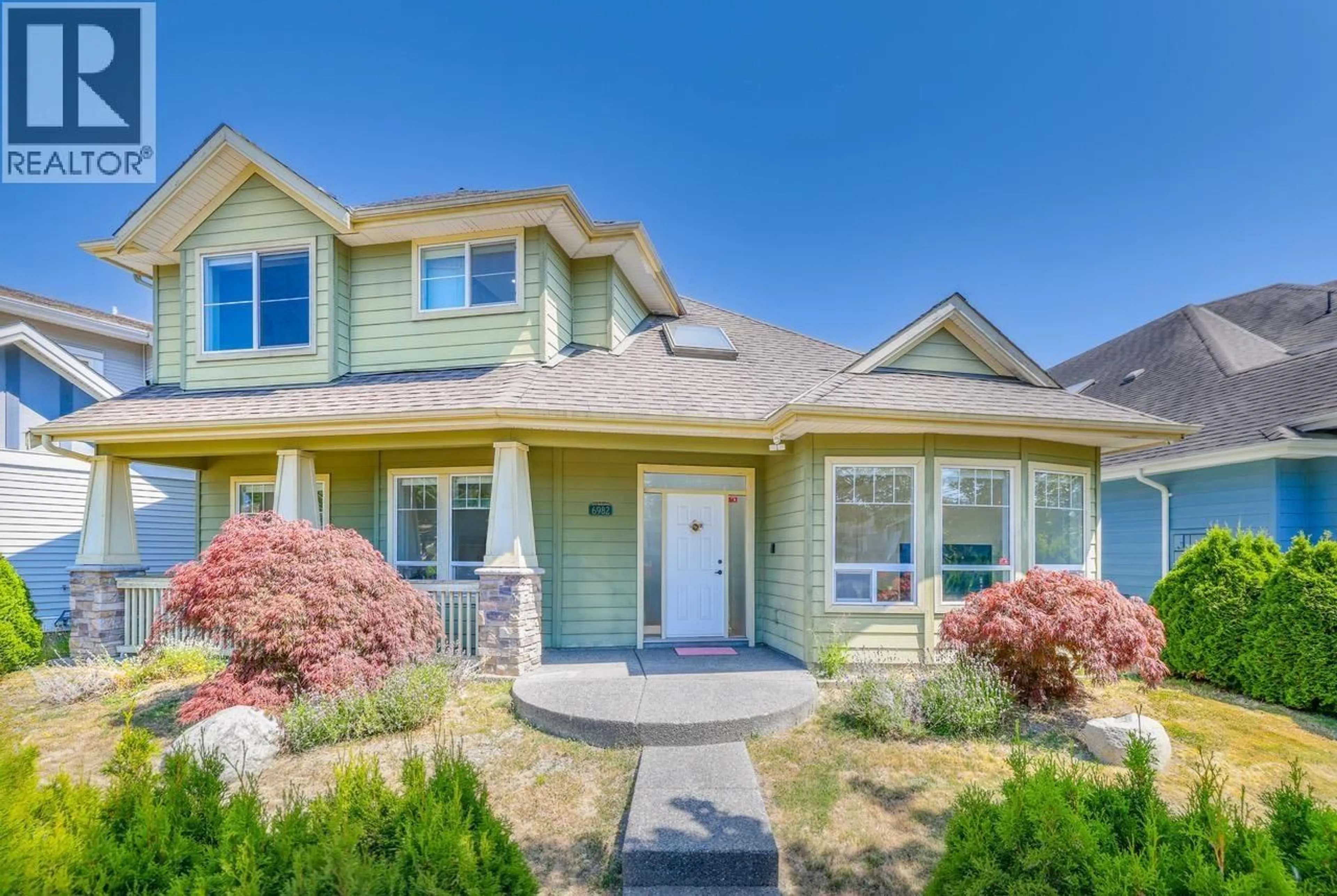 Home with vinyl exterior material, street for 6982 BARNARD DRIVE, Richmond British Columbia V7C5T5