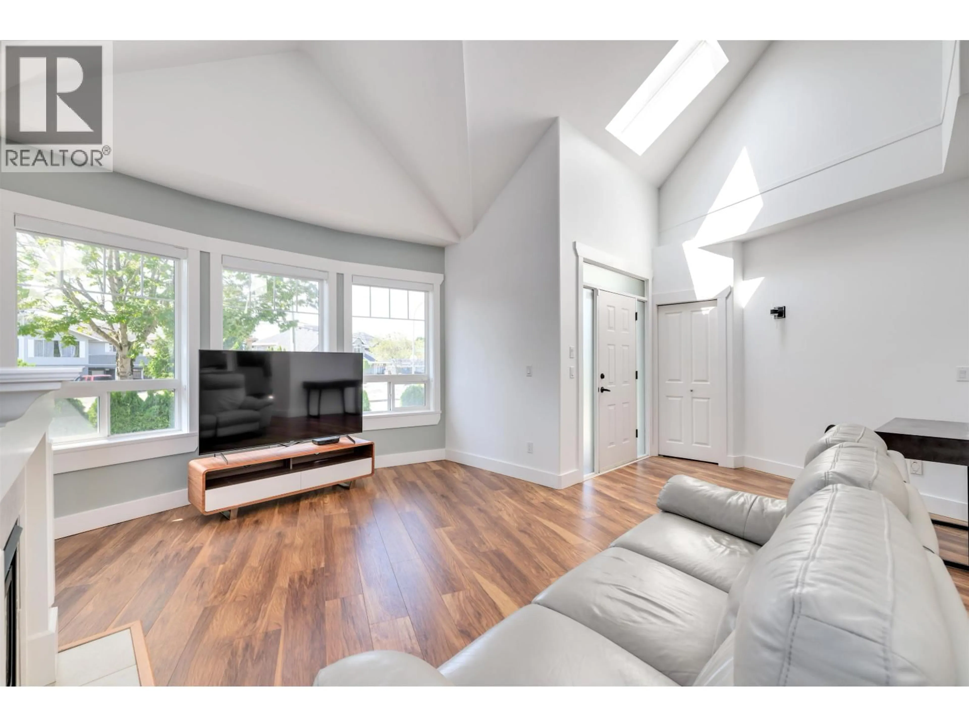 Living room with furniture, wood/laminate floor for 6982 BARNARD DRIVE, Richmond British Columbia V7C5T5