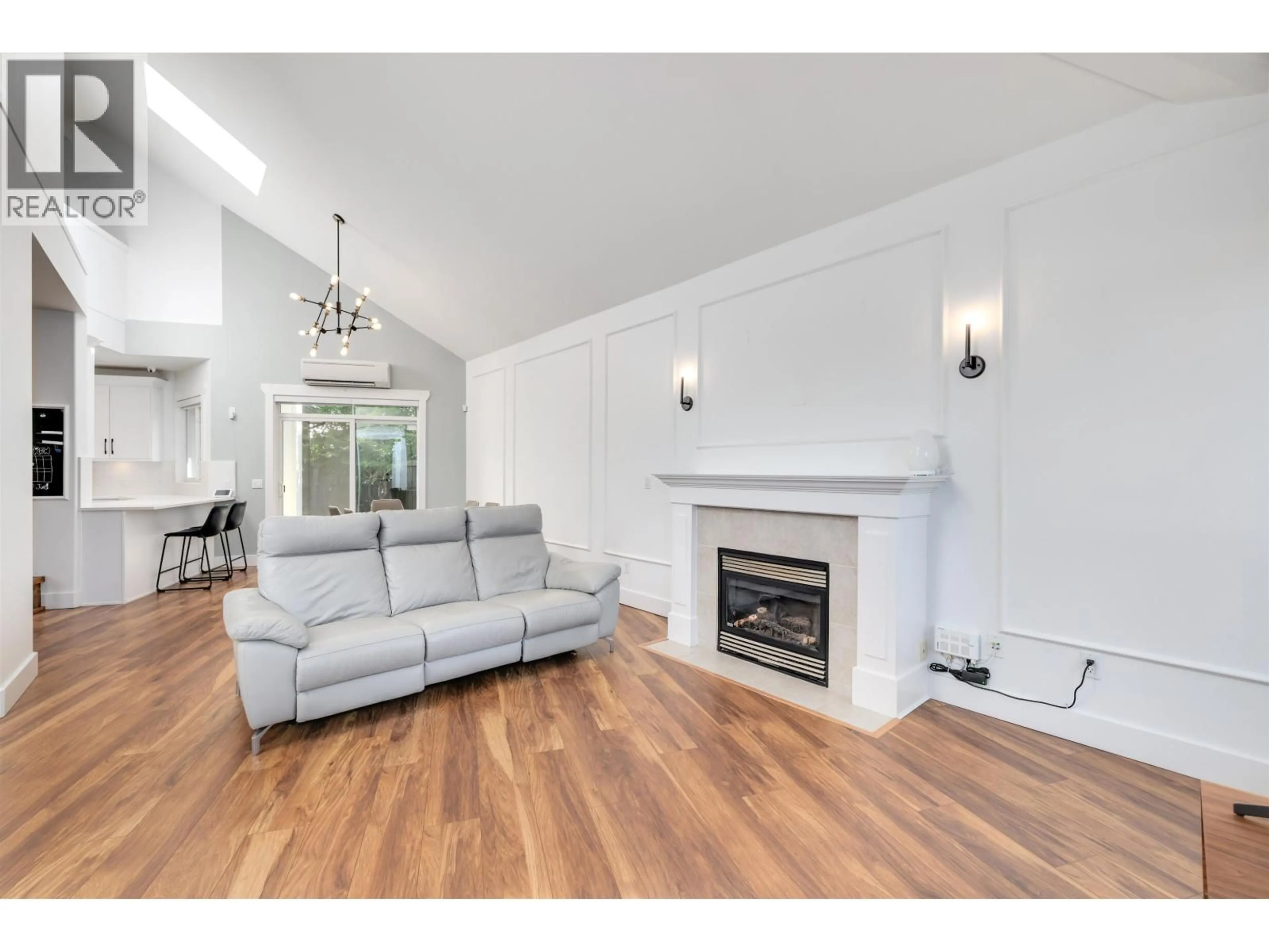 Living room with furniture, wood/laminate floor for 6982 BARNARD DRIVE, Richmond British Columbia V7C5T5