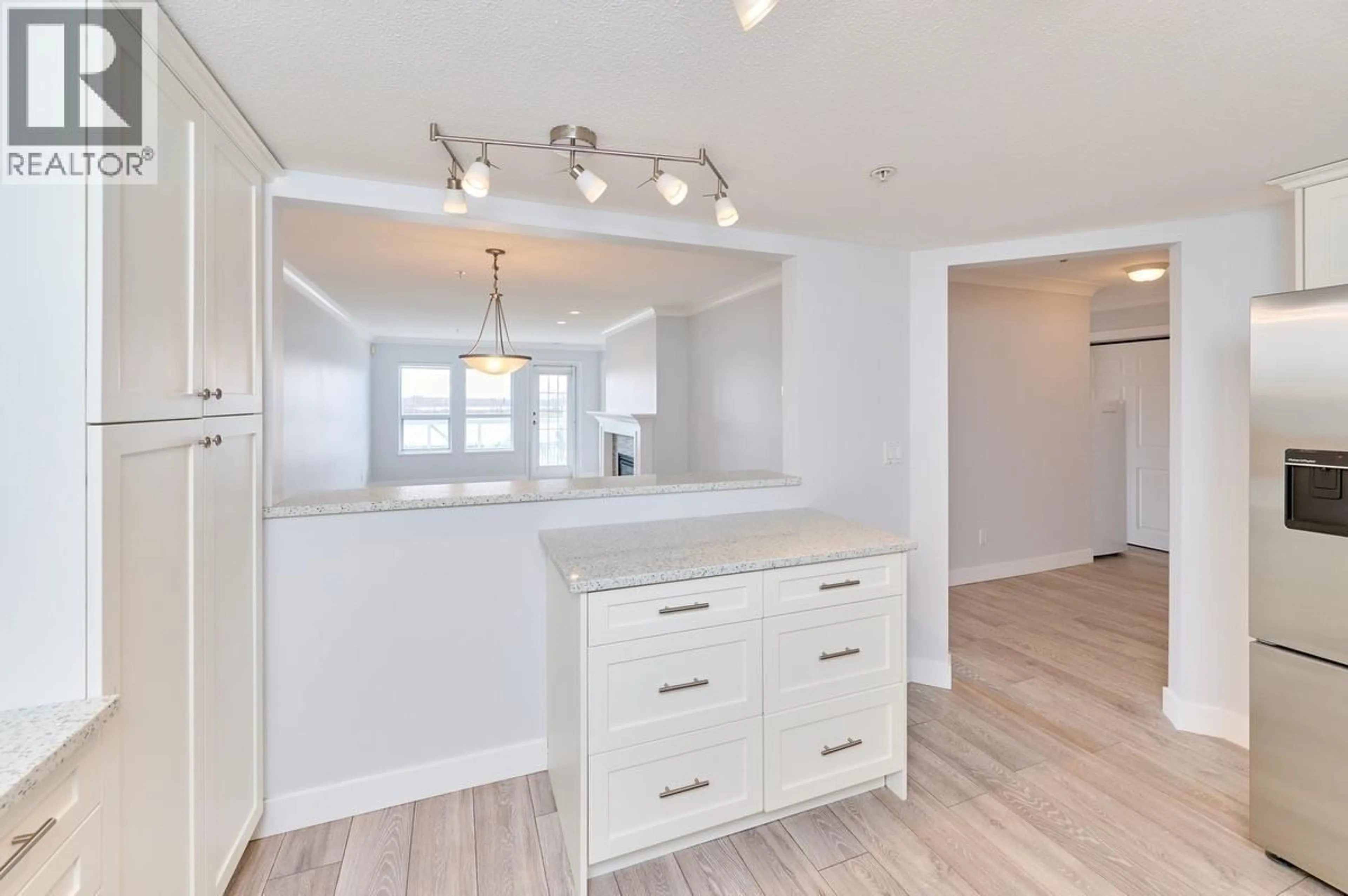 Open concept kitchen, wood/laminate floor for 228 - 12931 RAILWAY AVENUE, Richmond British Columbia V7E6M5