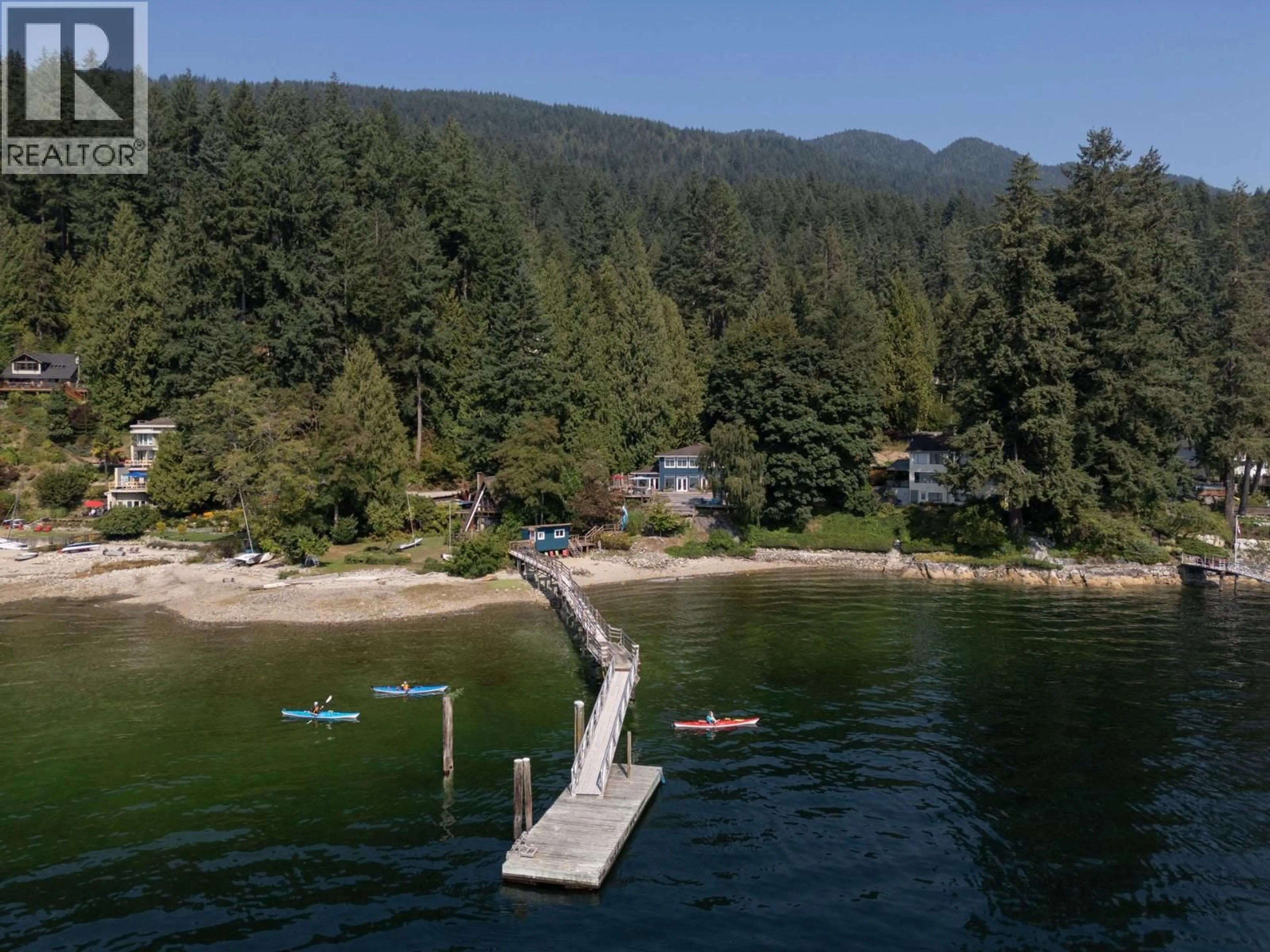 A pic from outside/outdoor area/front of a property/back of a property/a pic from drone, water/lake/river/ocean view for 5439 INDIAN RIVER DRIVE, North Vancouver British Columbia V7G2T7