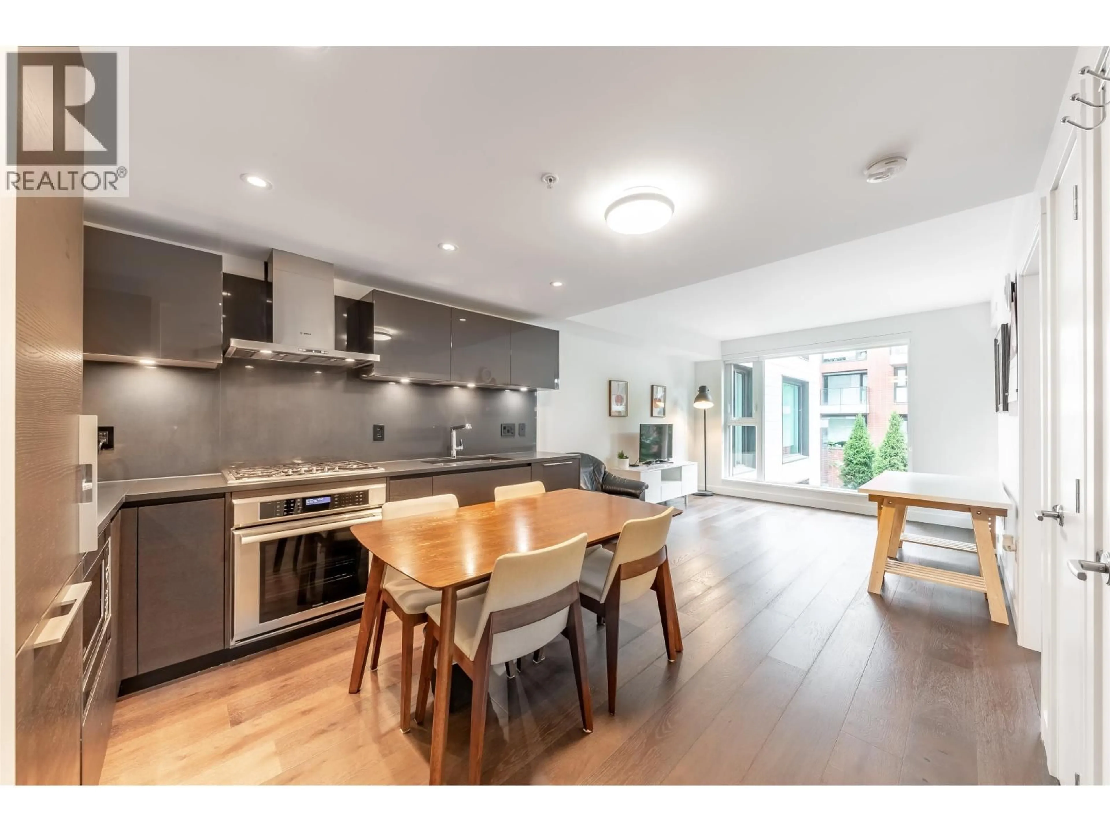 Open concept kitchen, wood/laminate floor for 201 - 1561 57TH AVENUE, Vancouver British Columbia V6P0H5