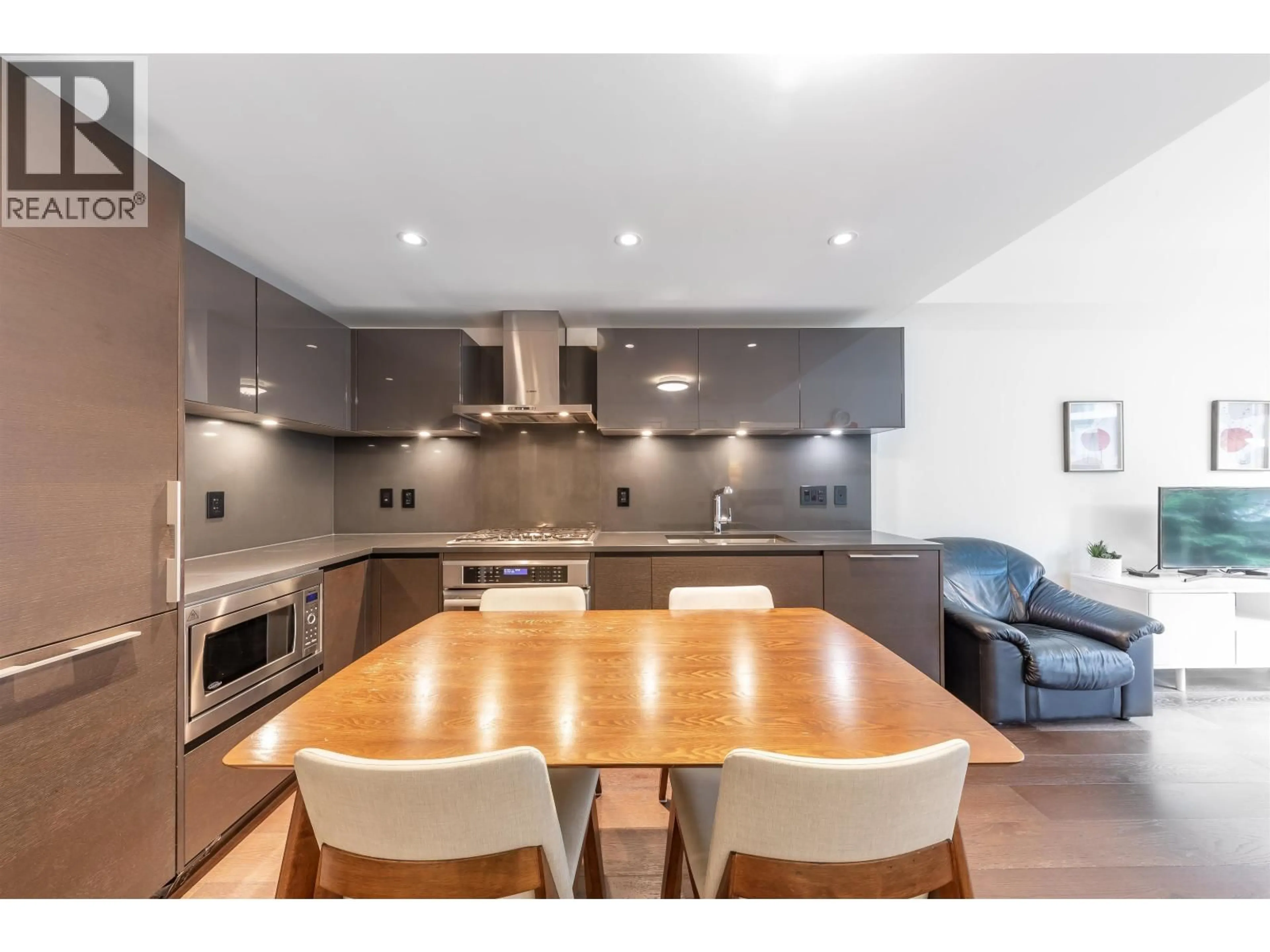 Open concept kitchen, wood/laminate floor for 201 - 1561 57TH AVENUE, Vancouver British Columbia V6P0H5
