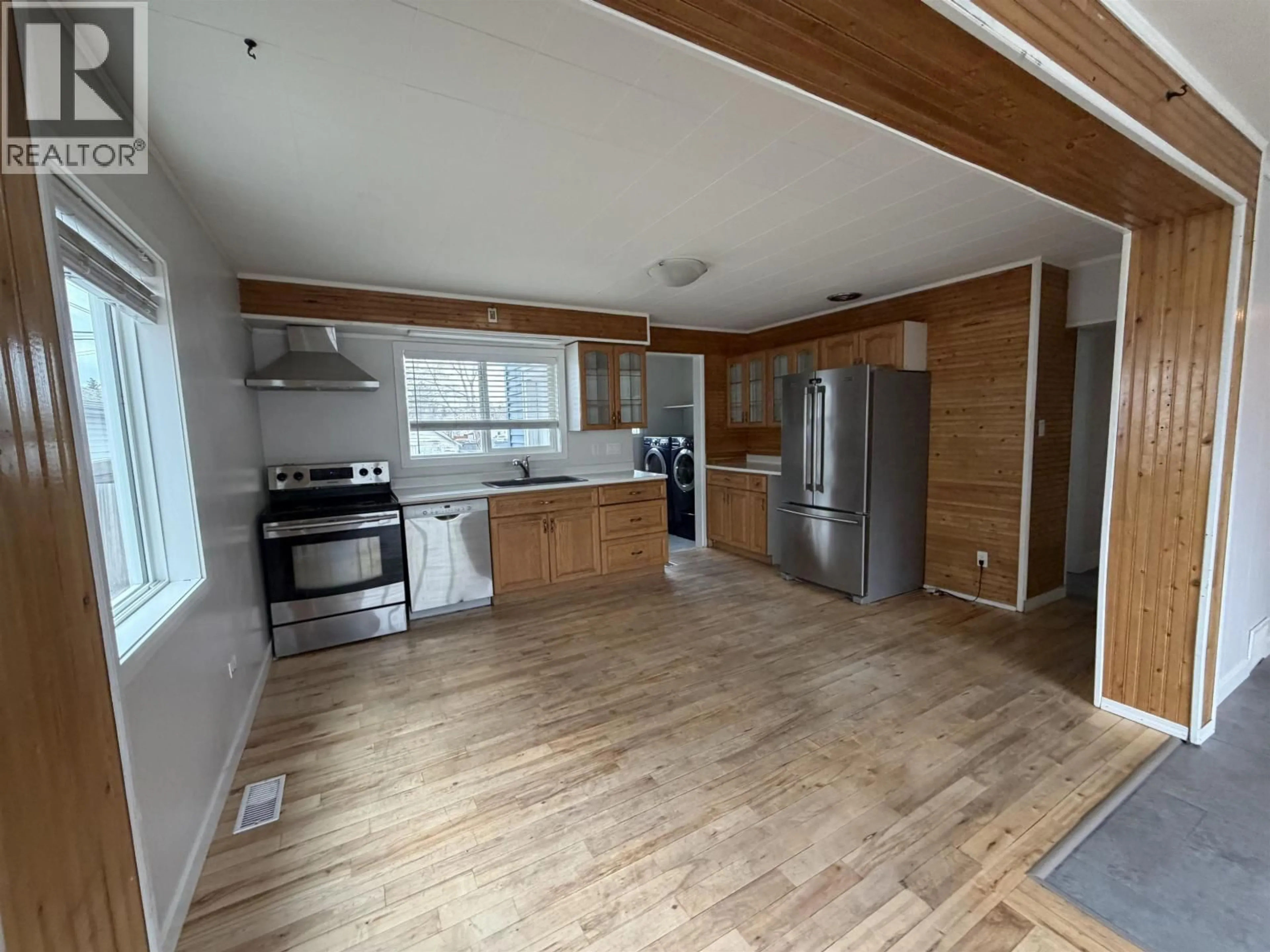 Open concept kitchen, wood/laminate floor for 235 BURDEN STREET, Prince George British Columbia V2M2H2