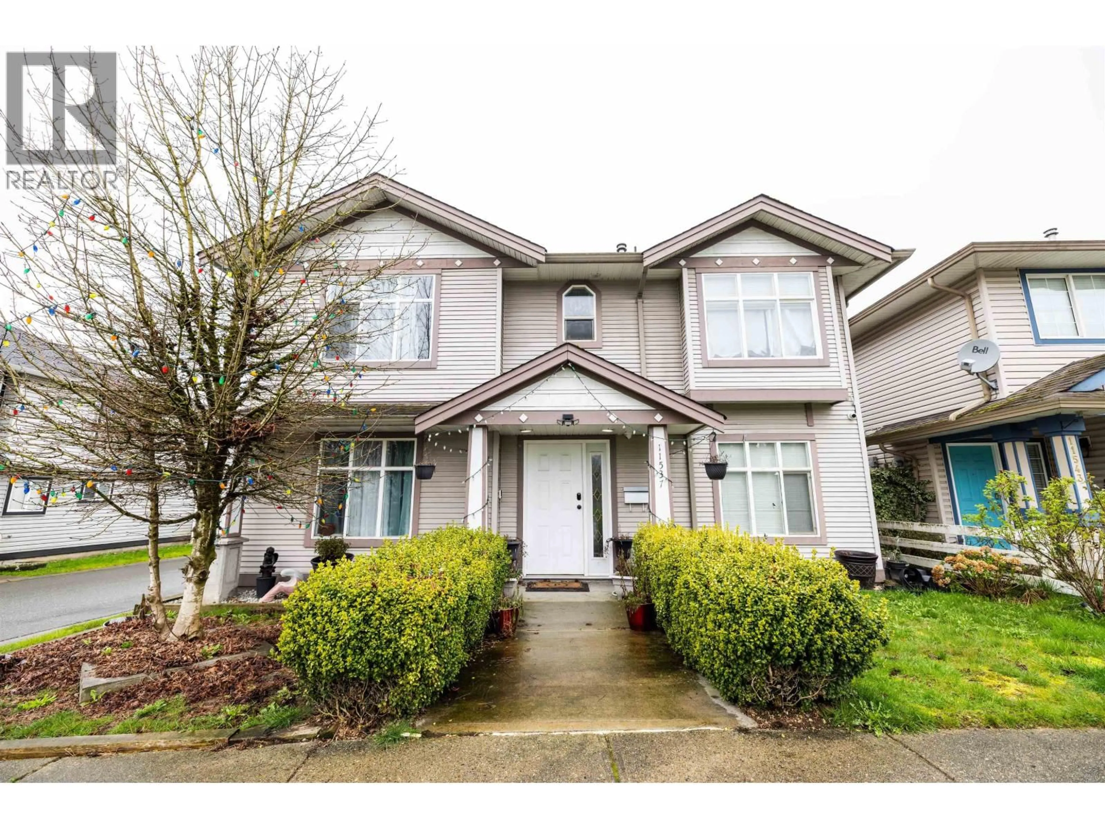 Home with vinyl exterior material, street for 11537 240 STREET, Maple Ridge British Columbia V2W1A3