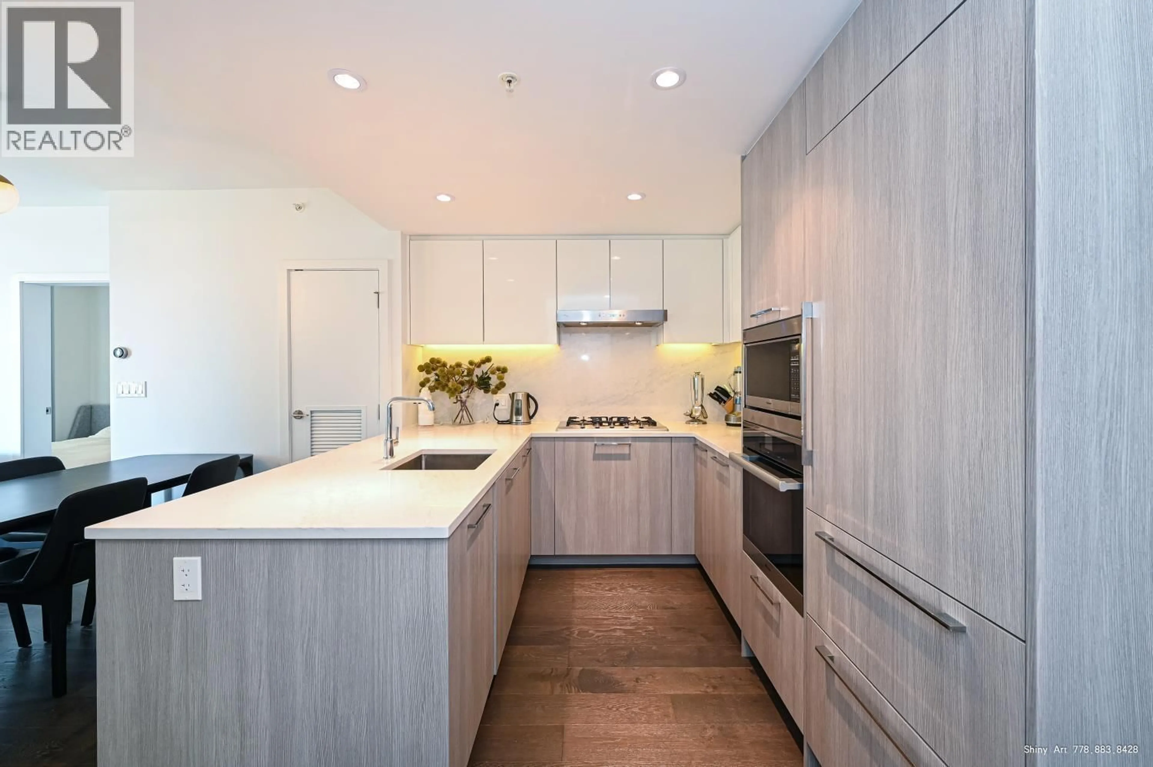 Contemporary kitchen, wood/laminate floor for 701 - 3200 CORVETTE WAY, Richmond British Columbia V6X0T8