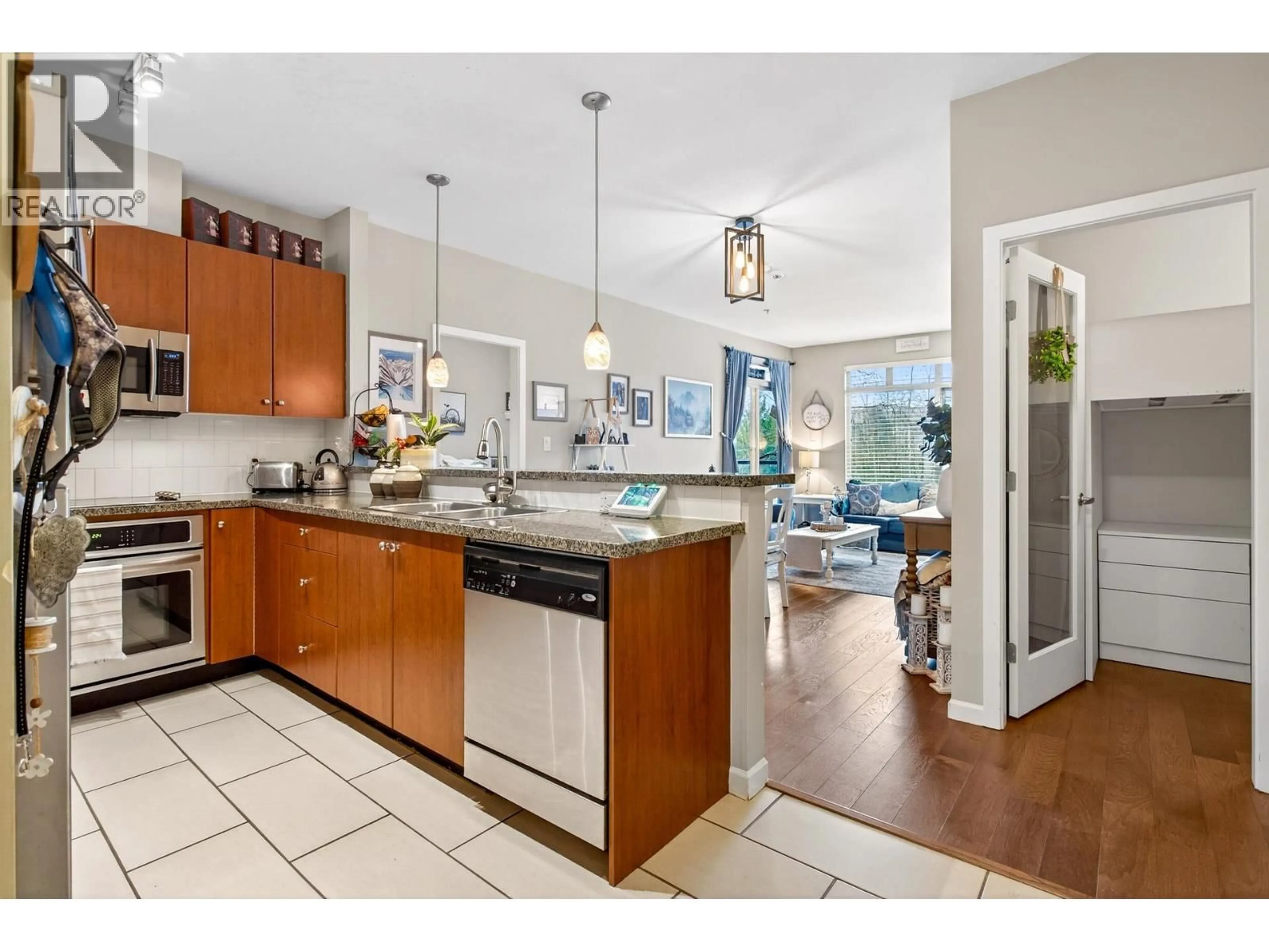 Open concept kitchen, ceramic/tile floor for 302 - 100 CAPILANO ROAD, Port Moody British Columbia V3H5M9