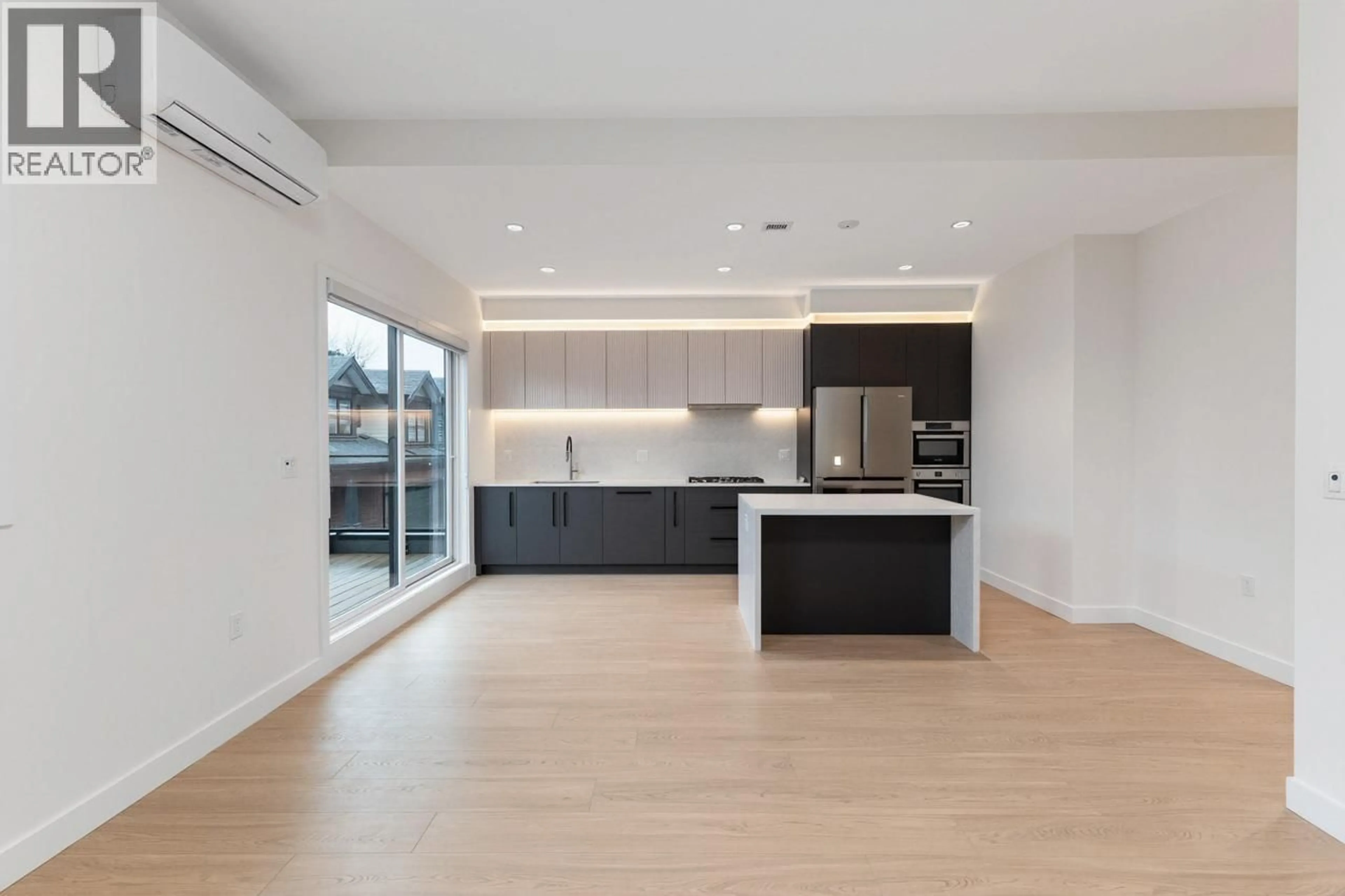 Open concept kitchen, wood/laminate floor for 11 - 10233 NO. 2 ROAD, Richmond British Columbia V7E0C7