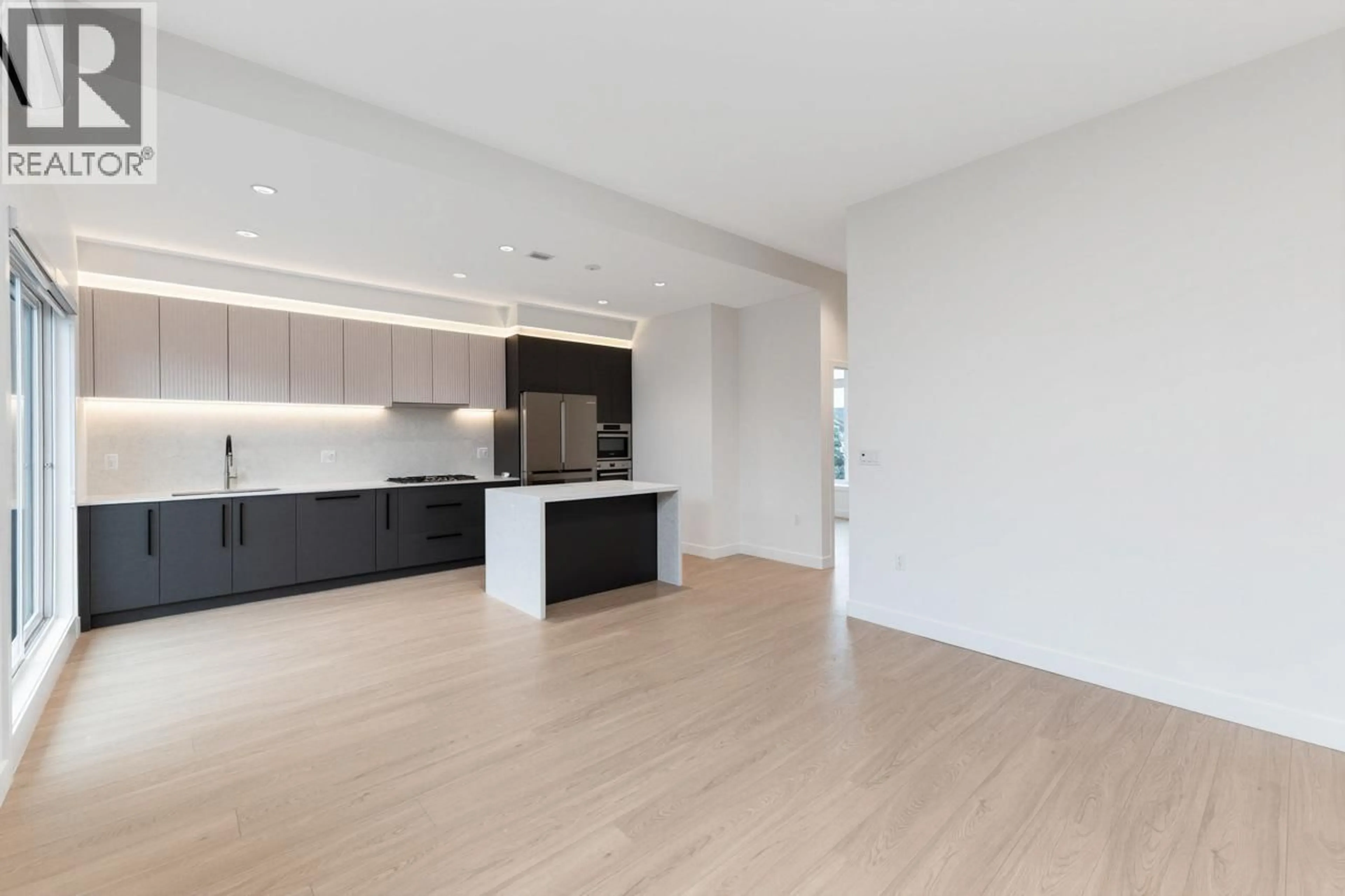 Open concept kitchen, wood/laminate floor for 11 - 10233 NO. 2 ROAD, Richmond British Columbia V7E0C7