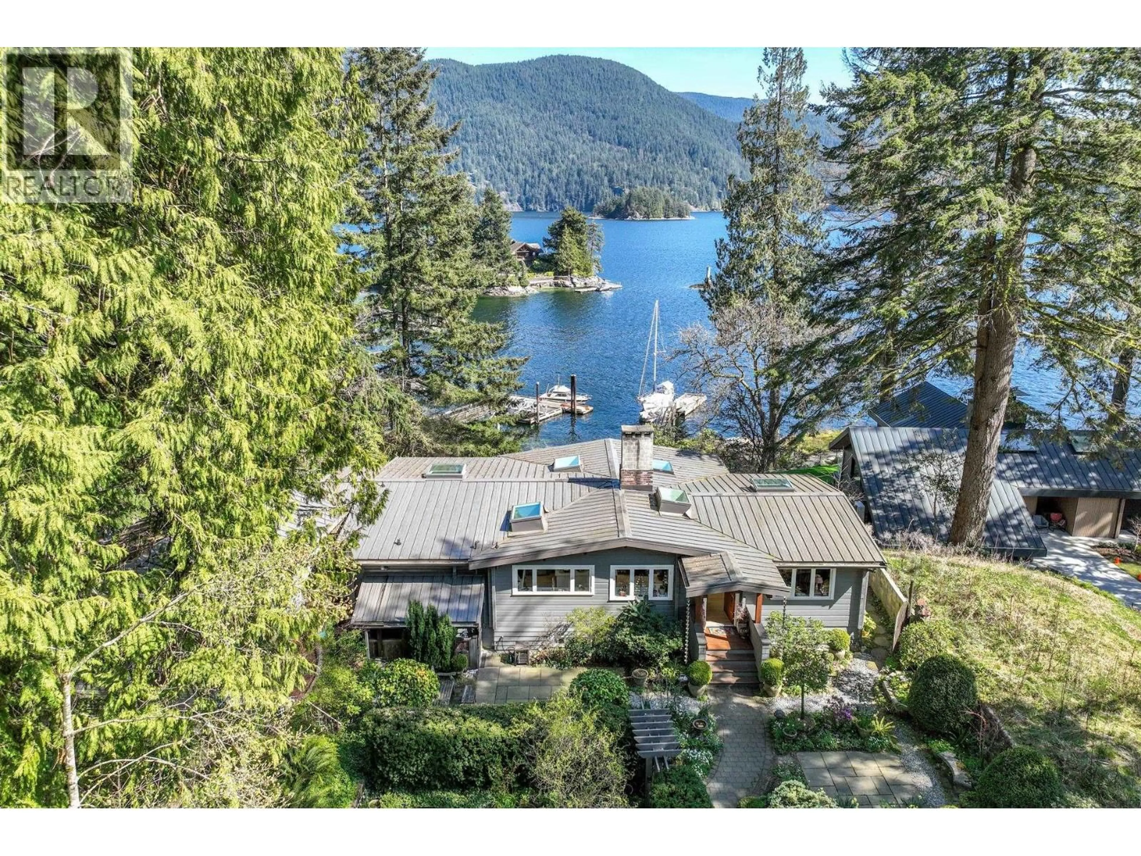 A pic from outside/outdoor area/front of a property/back of a property/a pic from drone, water/lake/river/ocean view for 5457 INDIAN RIVER DRIVE, North Vancouver British Columbia V7G2T7