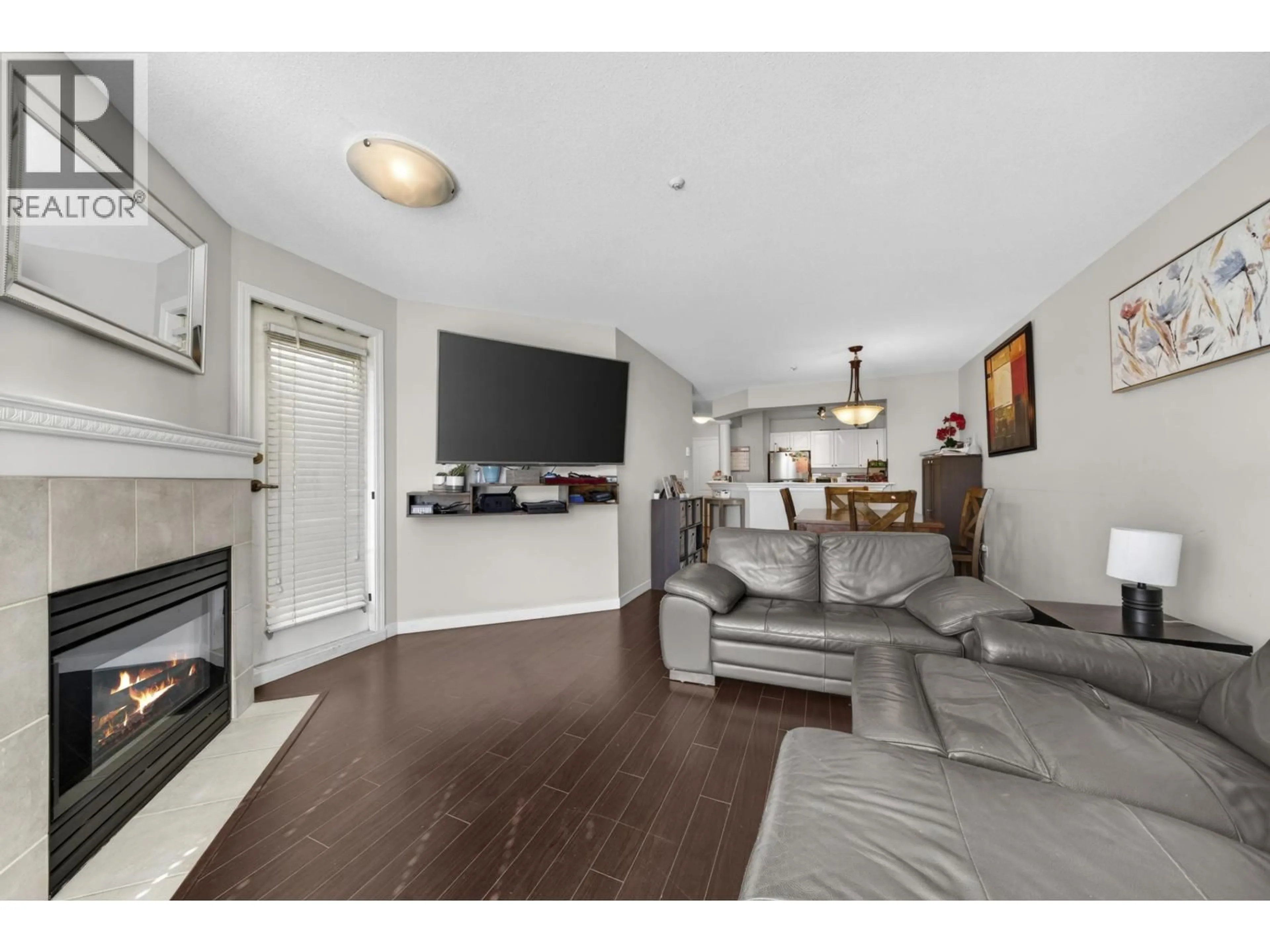 Living room with furniture, wood/laminate floor for 312 - 1655 GRANT AVENUE, Port Coquitlam British Columbia V3B7V1