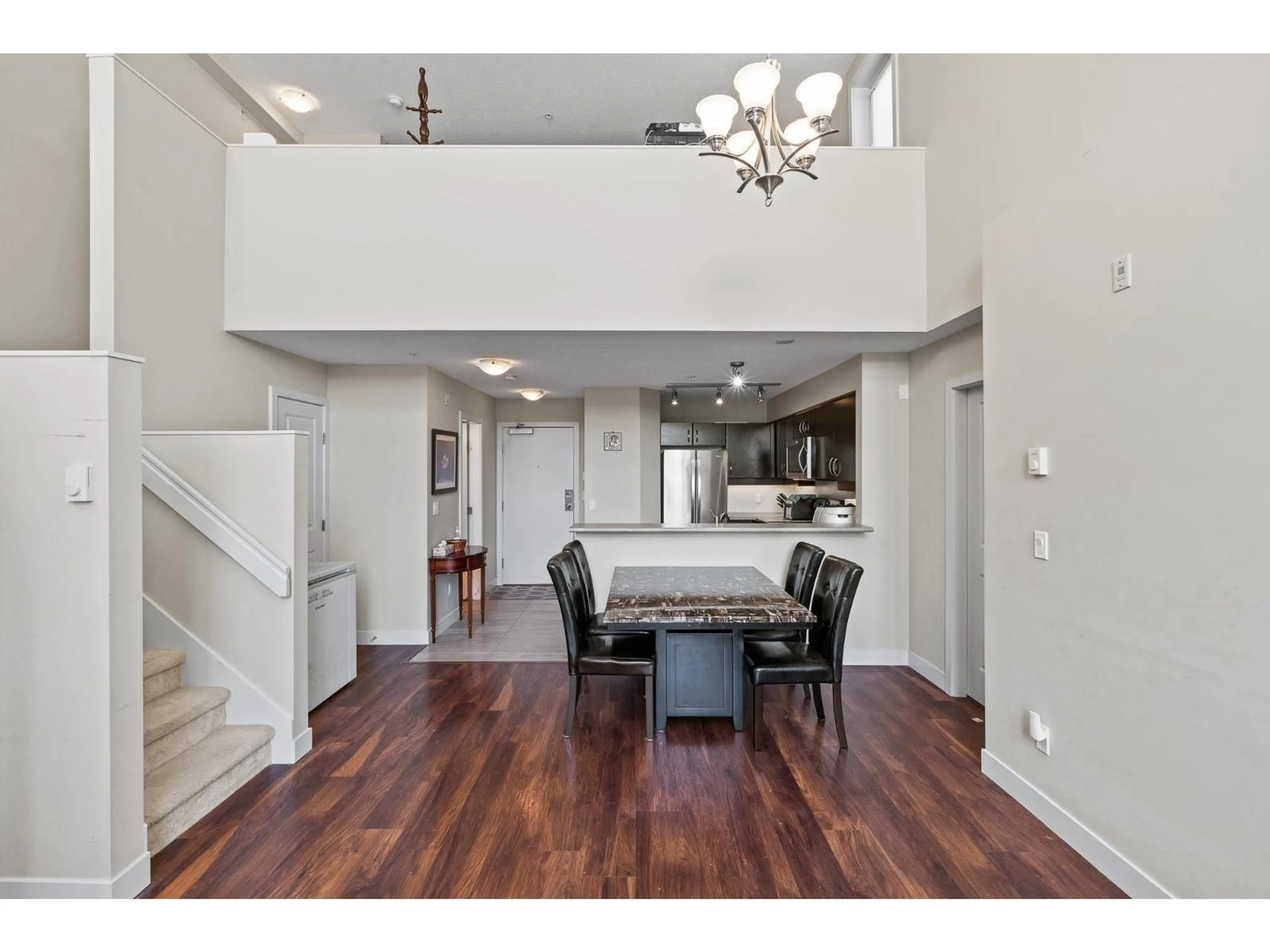 Open concept kitchen, wood/laminate floor for 452 - 10838 CITY PARKWAY, Surrey British Columbia V3T5X9