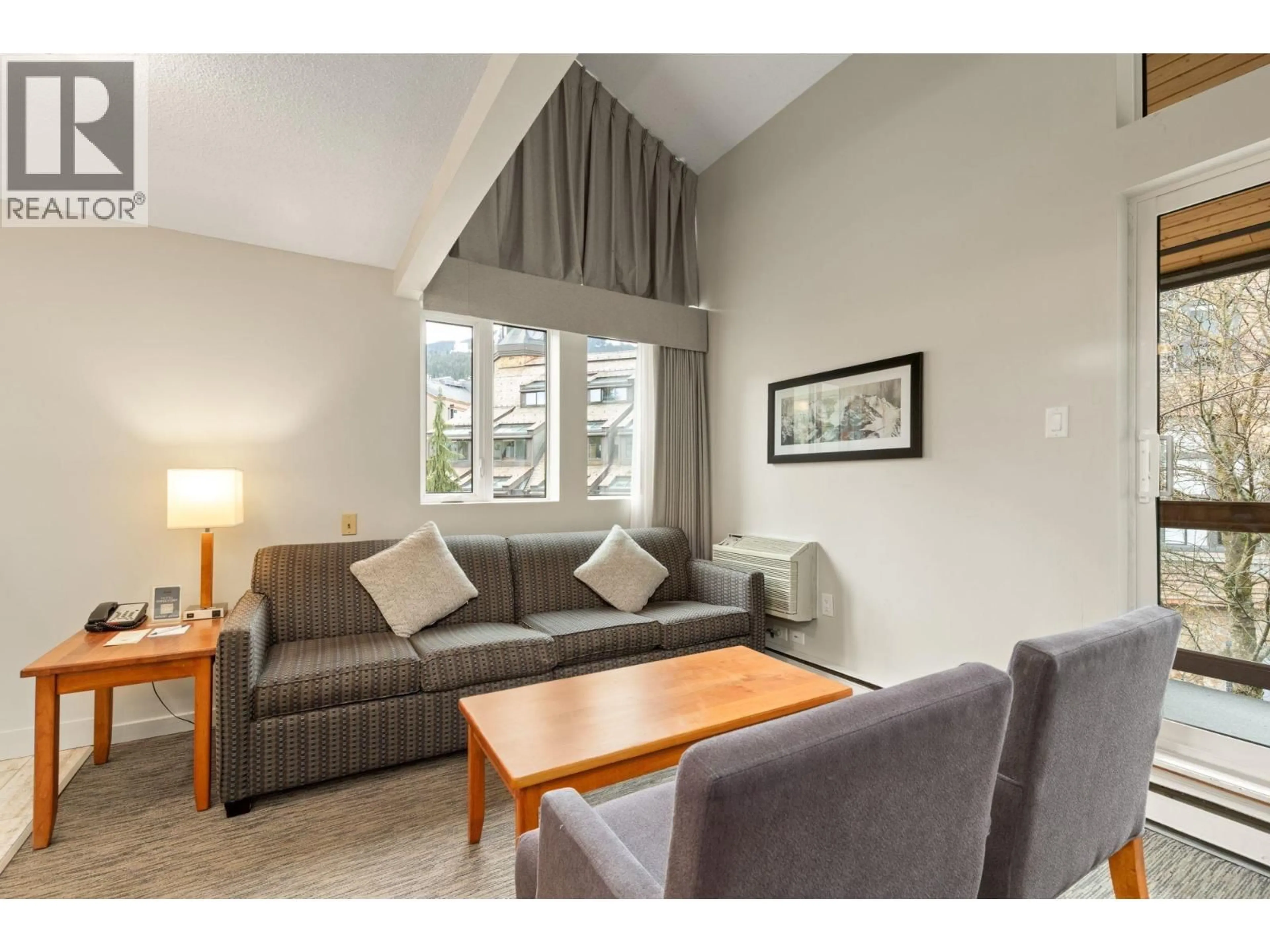 Living room with furniture, wood/laminate floor for 310 - 4420 SUNDIAL PLACE, Whistler British Columbia V8E1G6