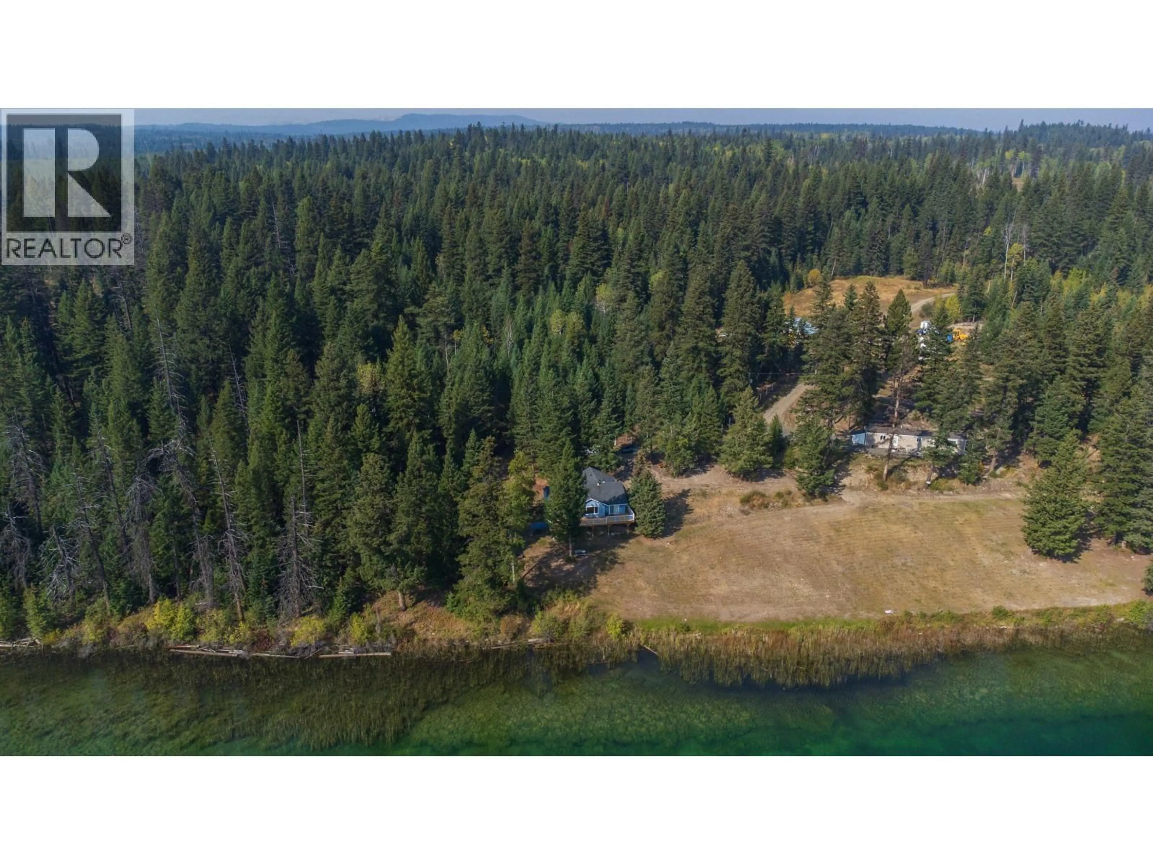 A pic from outside/outdoor area/front of a property/back of a property/a pic from drone, water/lake/river/ocean view for 2496 BIG LAKE-TYEE LAKE ROAD, Williams Lake British Columbia V2G4Y9