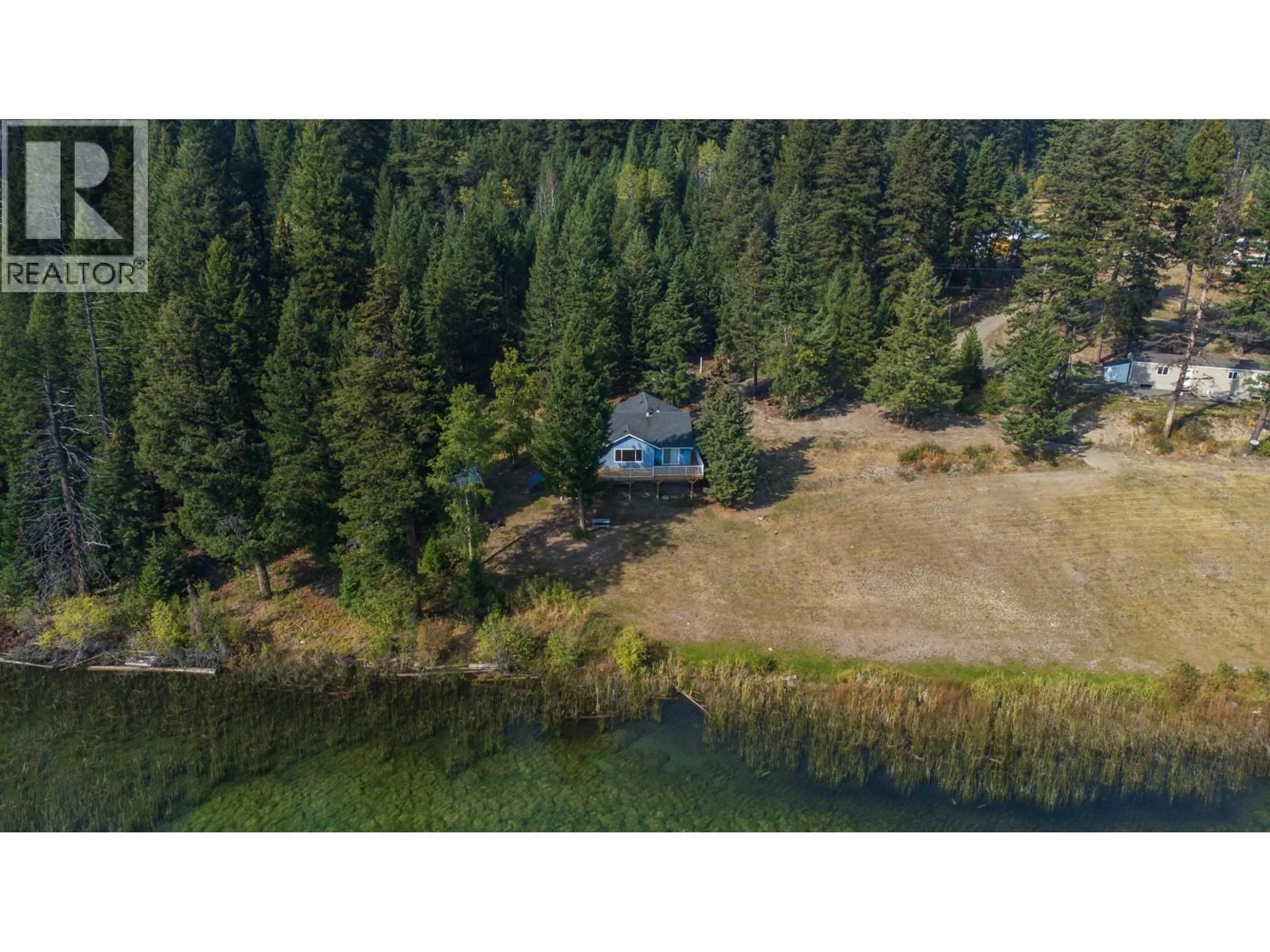 A pic from outside/outdoor area/front of a property/back of a property/a pic from drone, water/lake/river/ocean view for 2496 BIG LAKE-TYEE LAKE ROAD, Williams Lake British Columbia V2G4Y9