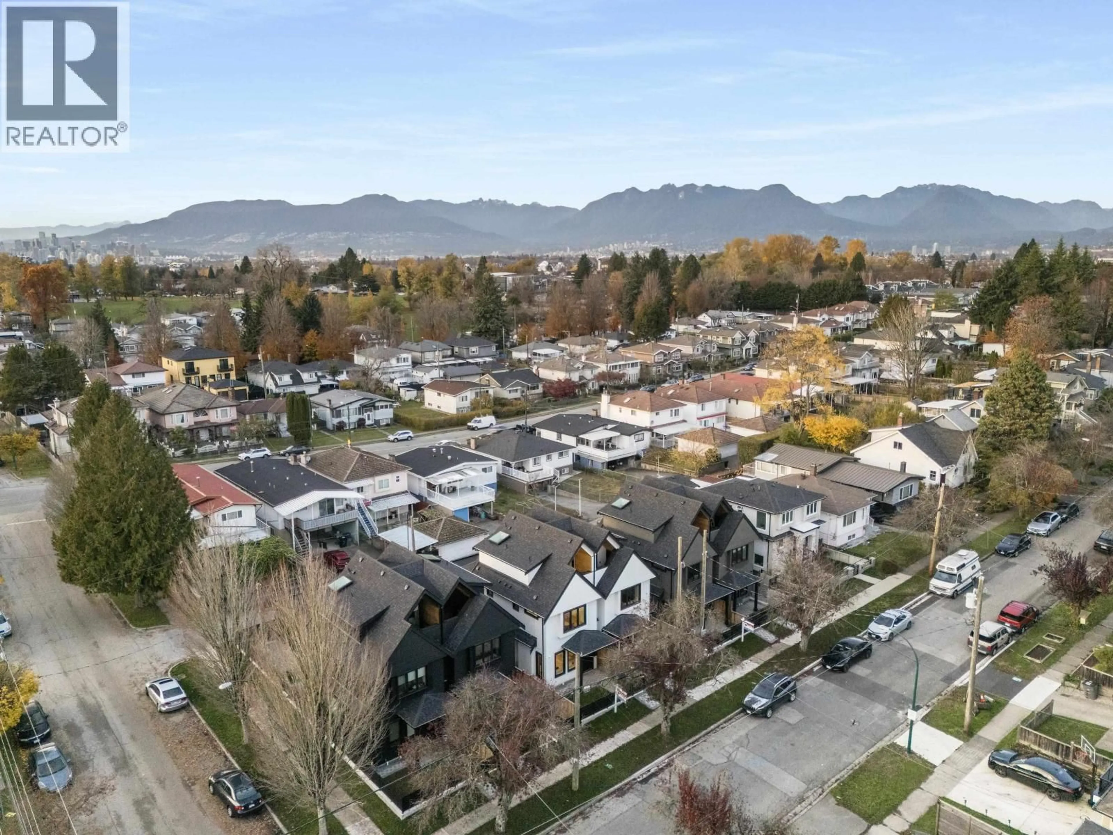 A pic from outside/outdoor area/front of a property/back of a property/a pic from drone, mountain view for 2 - 4885 MOSS STREET, Vancouver British Columbia V5R3T3