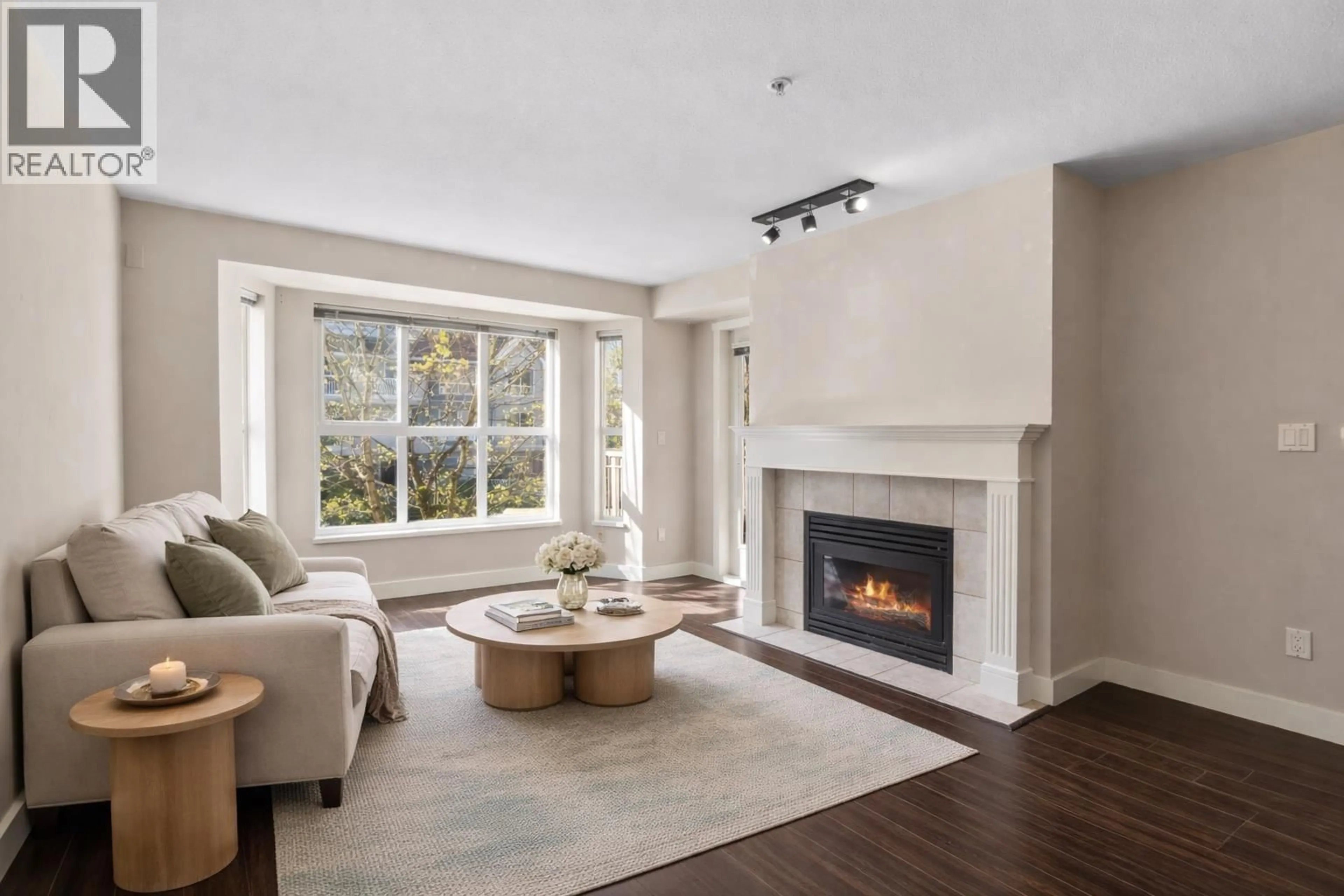 Living room with furniture, unknown for 205 - 2393 WELCHER AVENUE, Port Coquitlam British Columbia V3C1X6