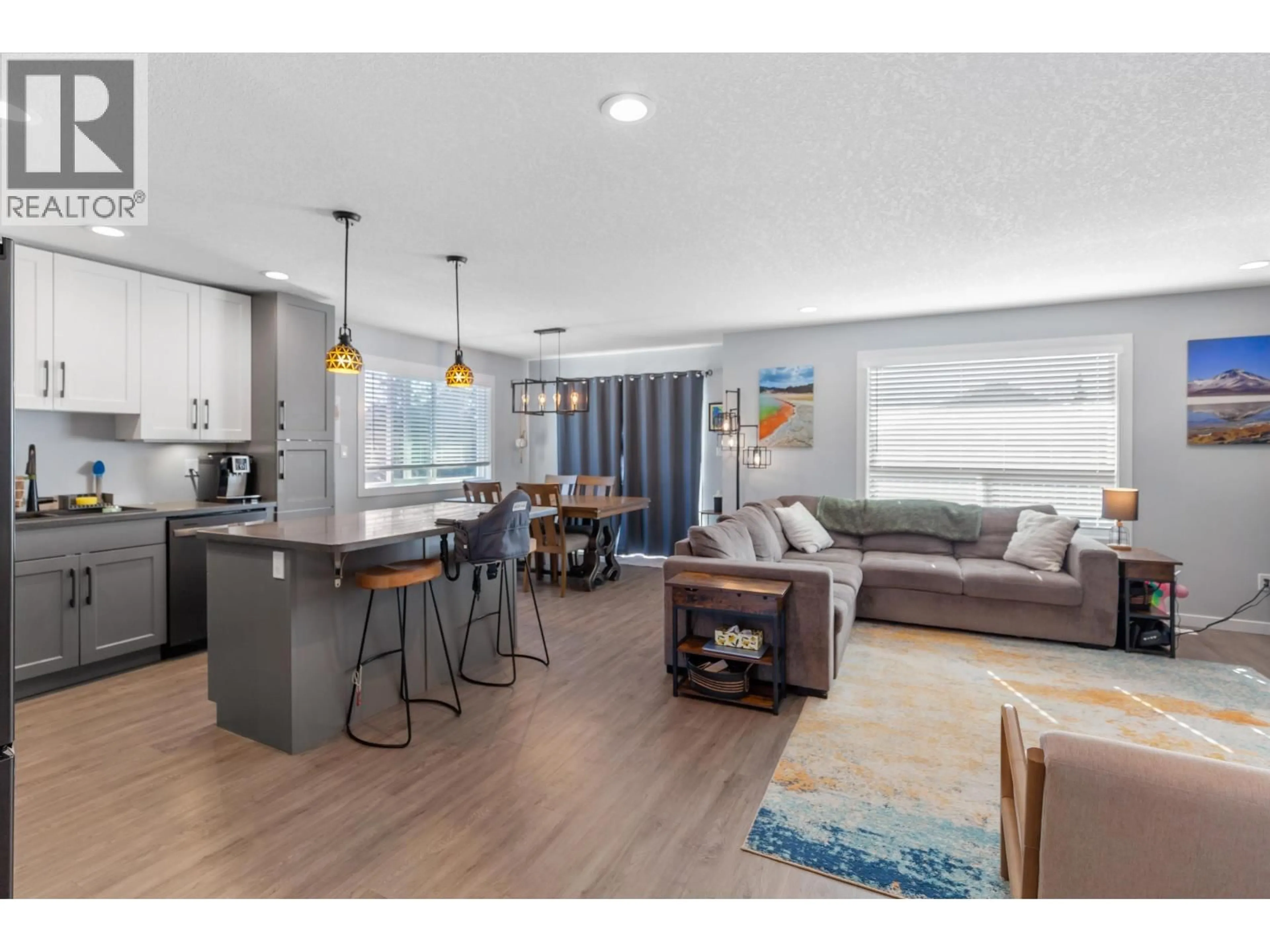 Open concept kitchen, wood/laminate floor for 9083 TATLOW PLACE, Prince George British Columbia V2K5A6