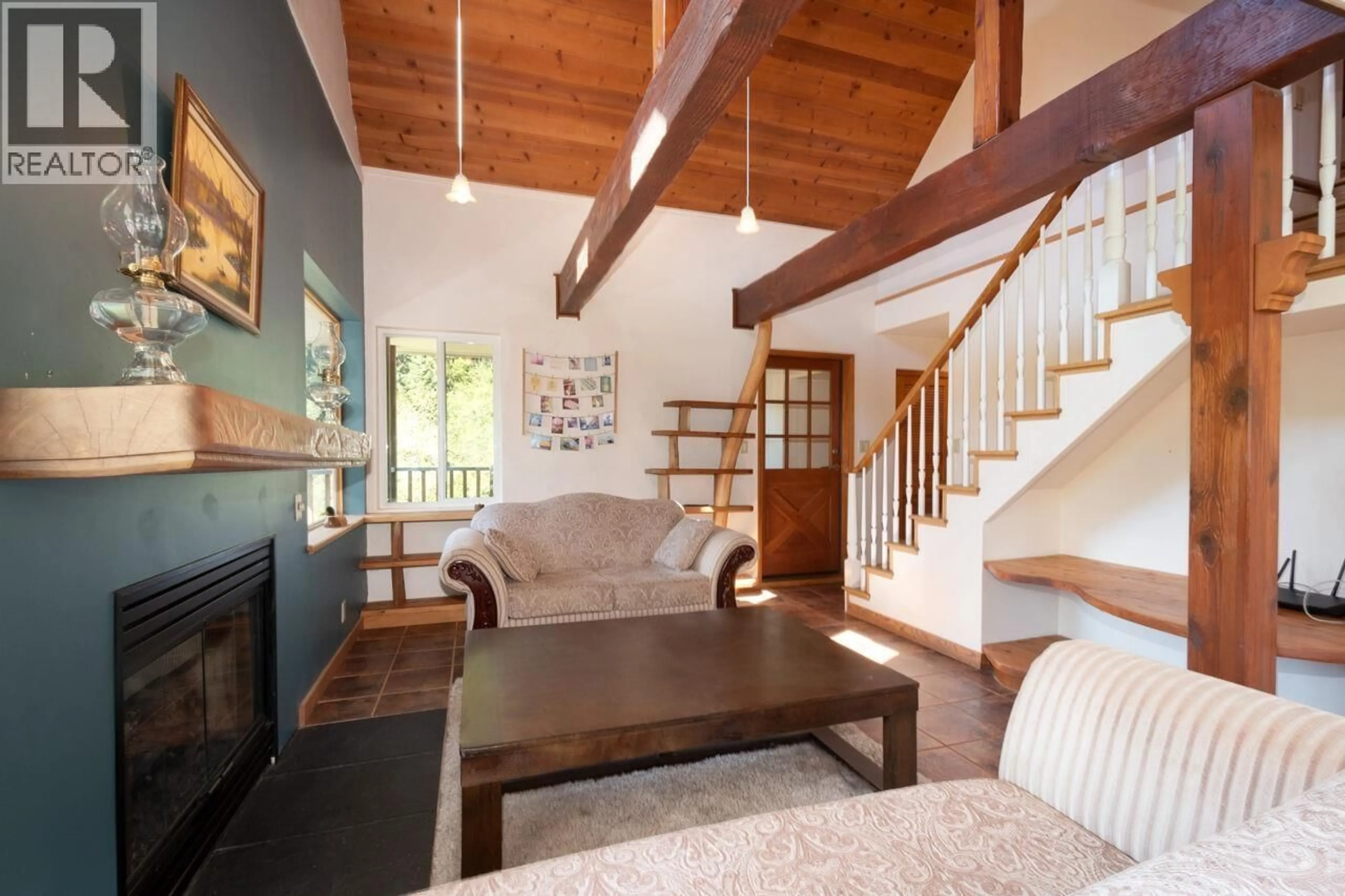 Living room with furniture, wood/laminate floor for 1293 WESTSIDE ROAD, Bowen Island British Columbia V0N1G2