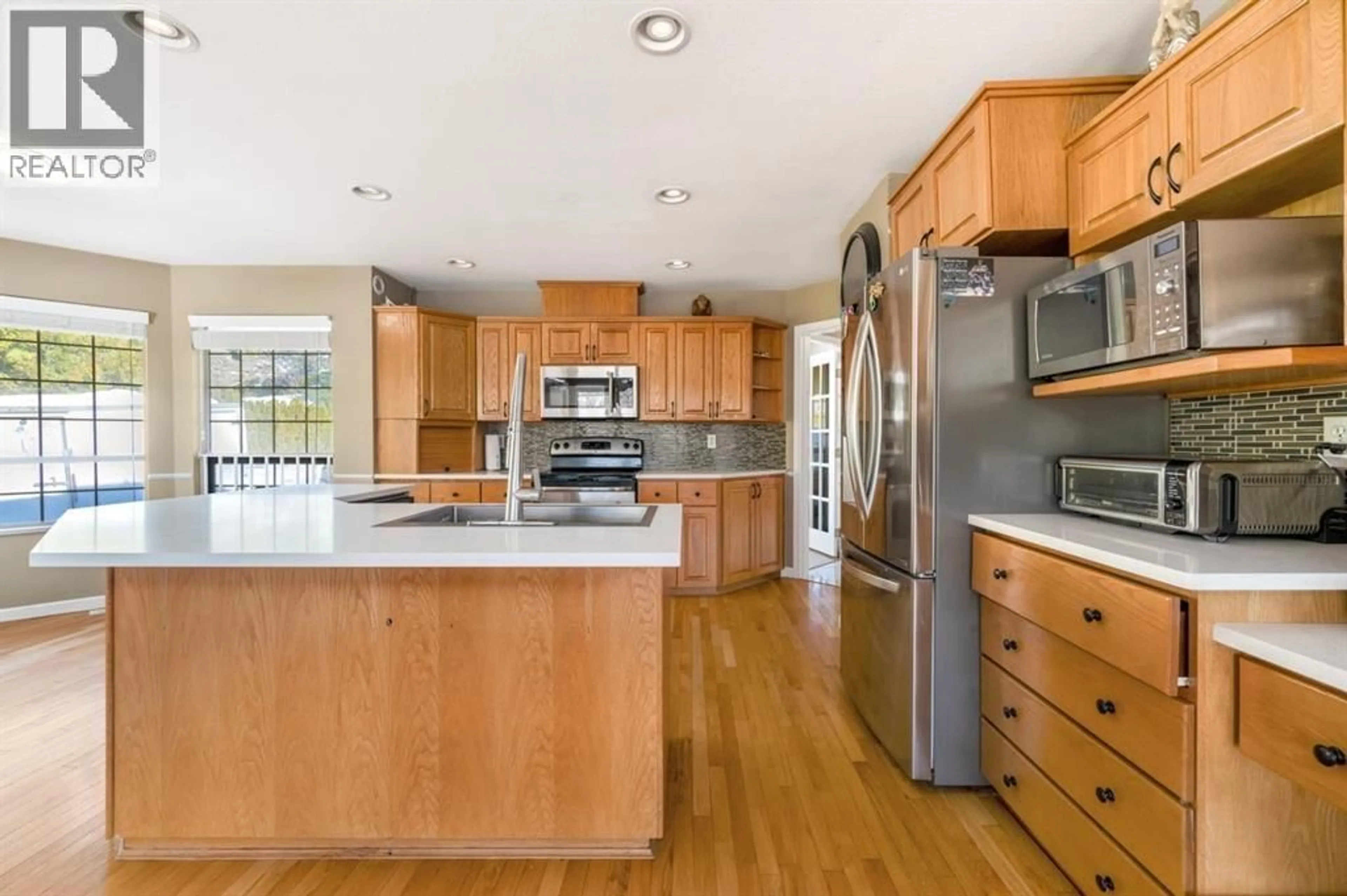 Open concept kitchen, wood/laminate floor for 12753 261 STREET, Maple Ridge British Columbia V2W1C3