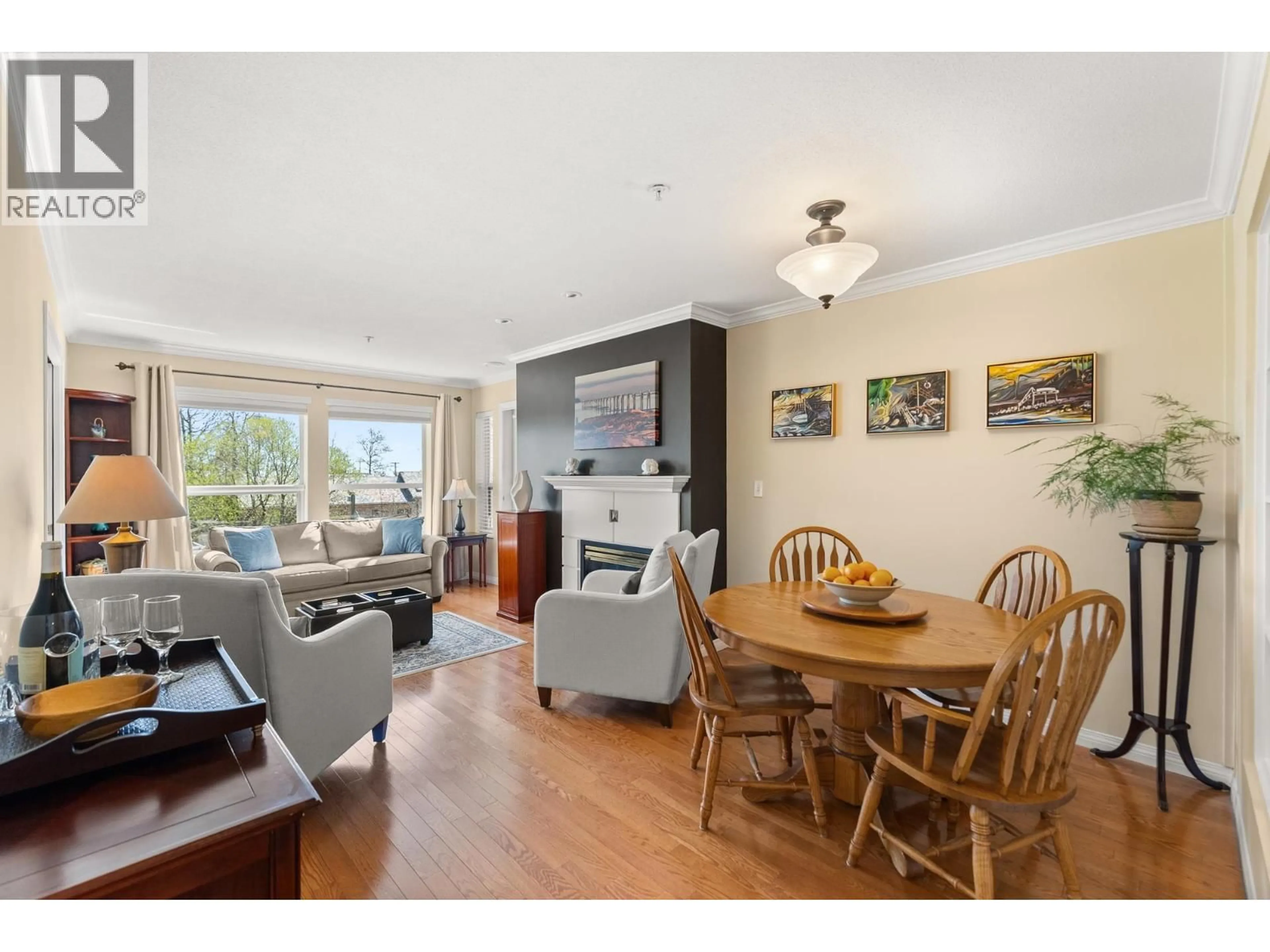 Living room with furniture, wood/laminate floor for 225 - 12931 RAILWAY AVENUE, Richmond British Columbia V7E6M5