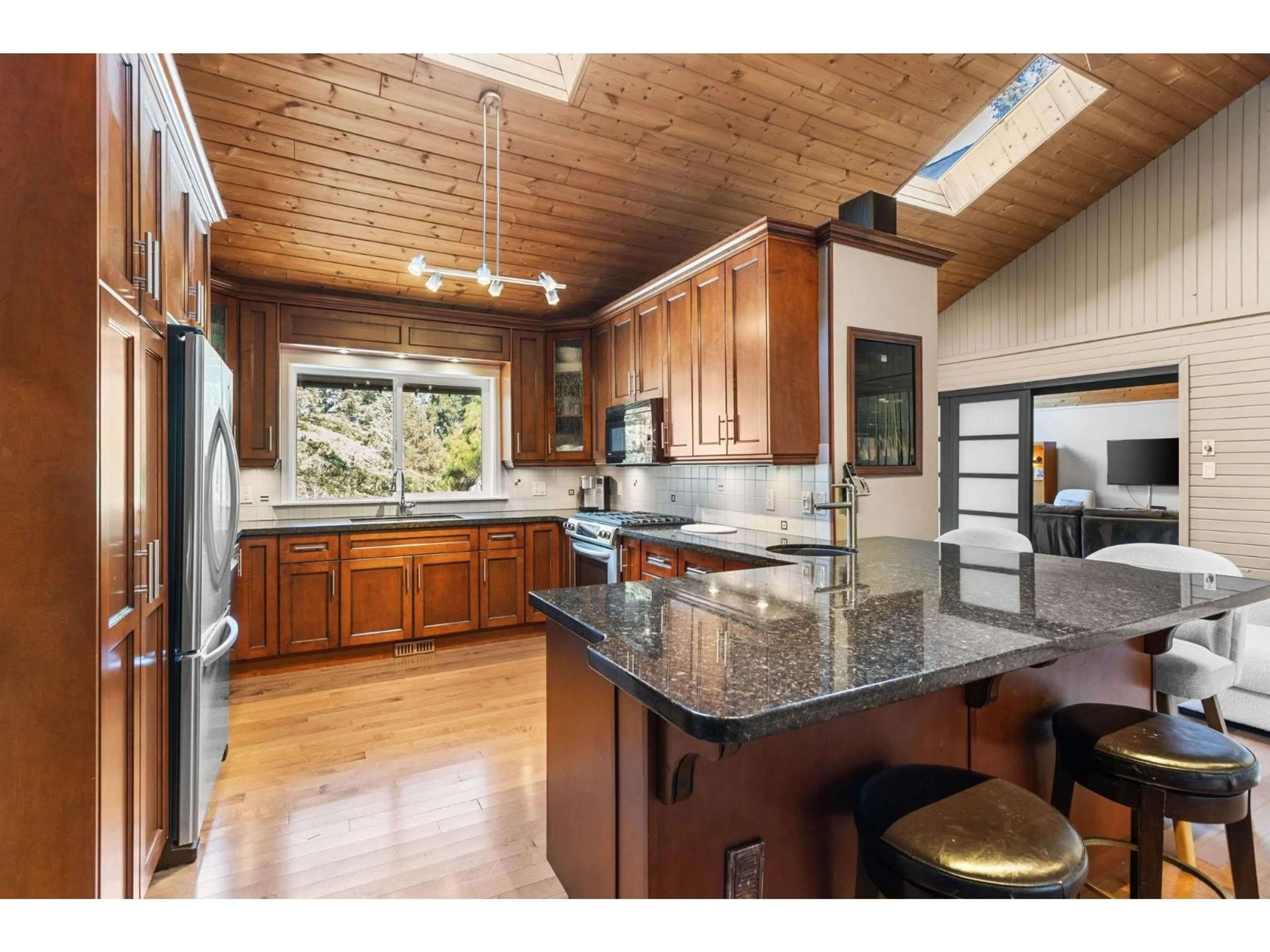 Open concept kitchen, wood/laminate floor for 23808 58A AVENUE, Langley British Columbia V2Z1A5