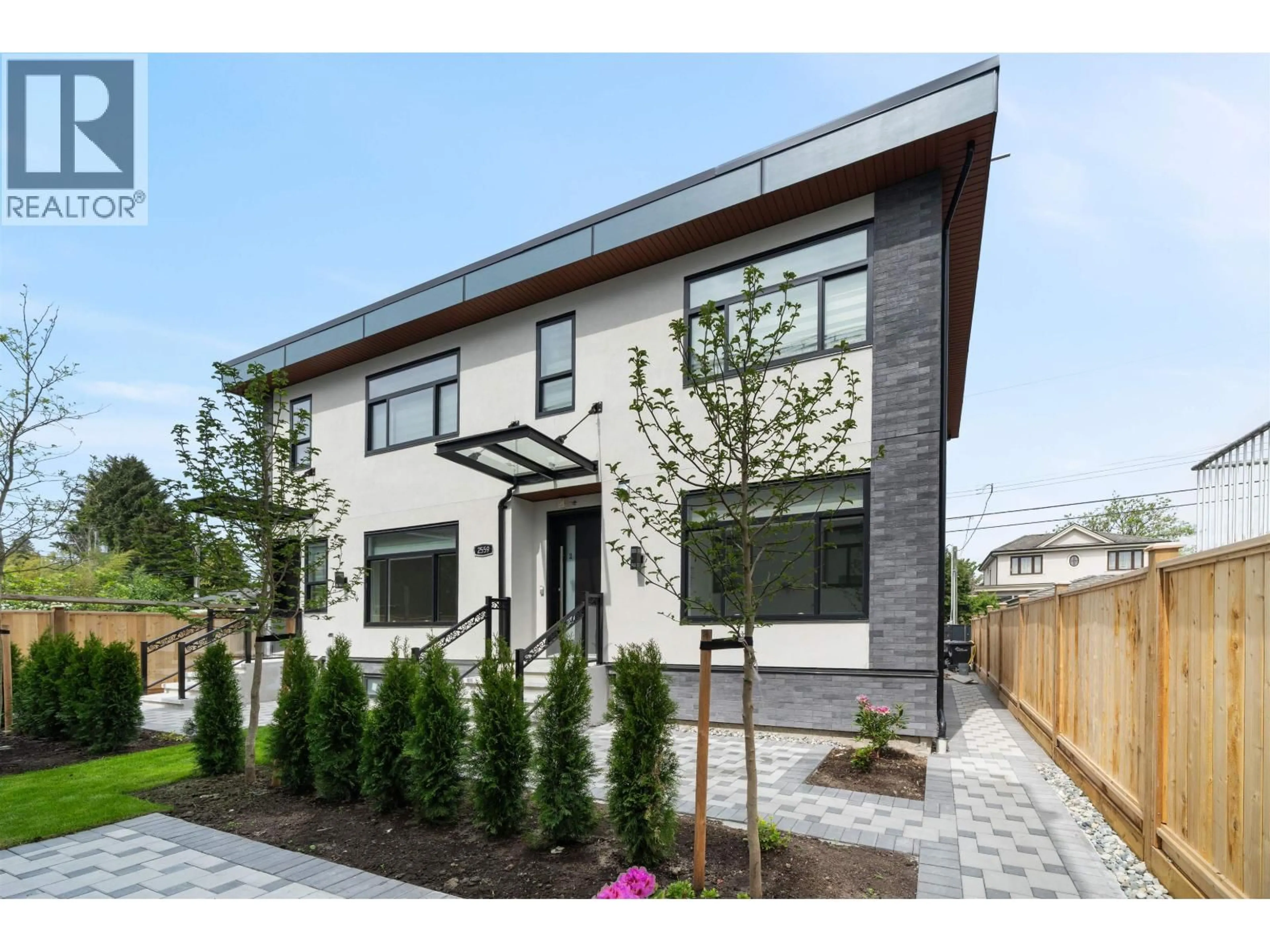 Home with brick exterior material, street for 2 - 2559 KING EDWARD AVENUE, Vancouver British Columbia V6L1T5