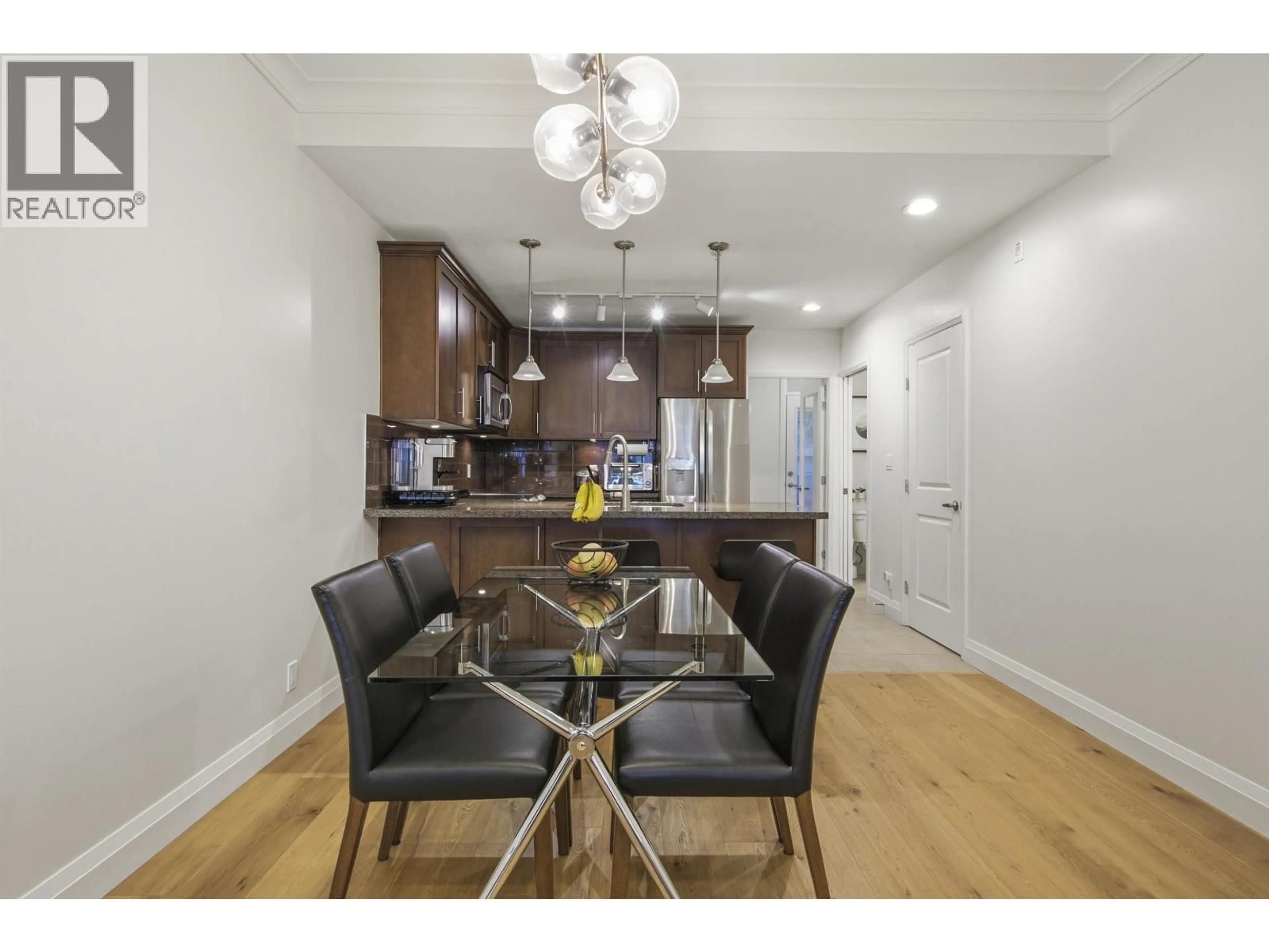 Open concept kitchen, wood/laminate floor for 219 - 5588 PATTERSON AVENUE, Burnaby British Columbia V5H0A7