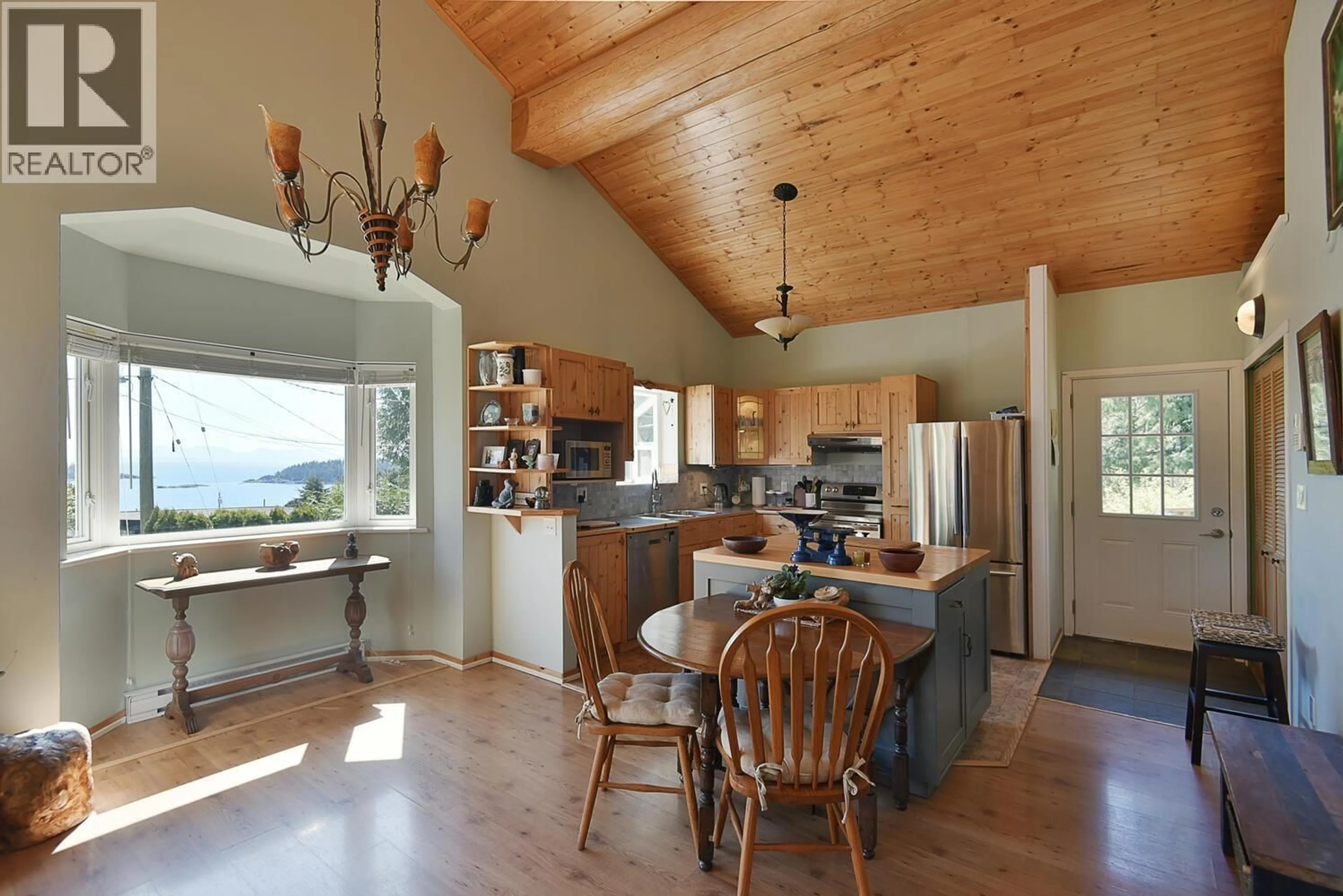 Open concept kitchen, wood/laminate floor for 6508 LYNNWOOD COURT, Sechelt British Columbia V7Z0S9