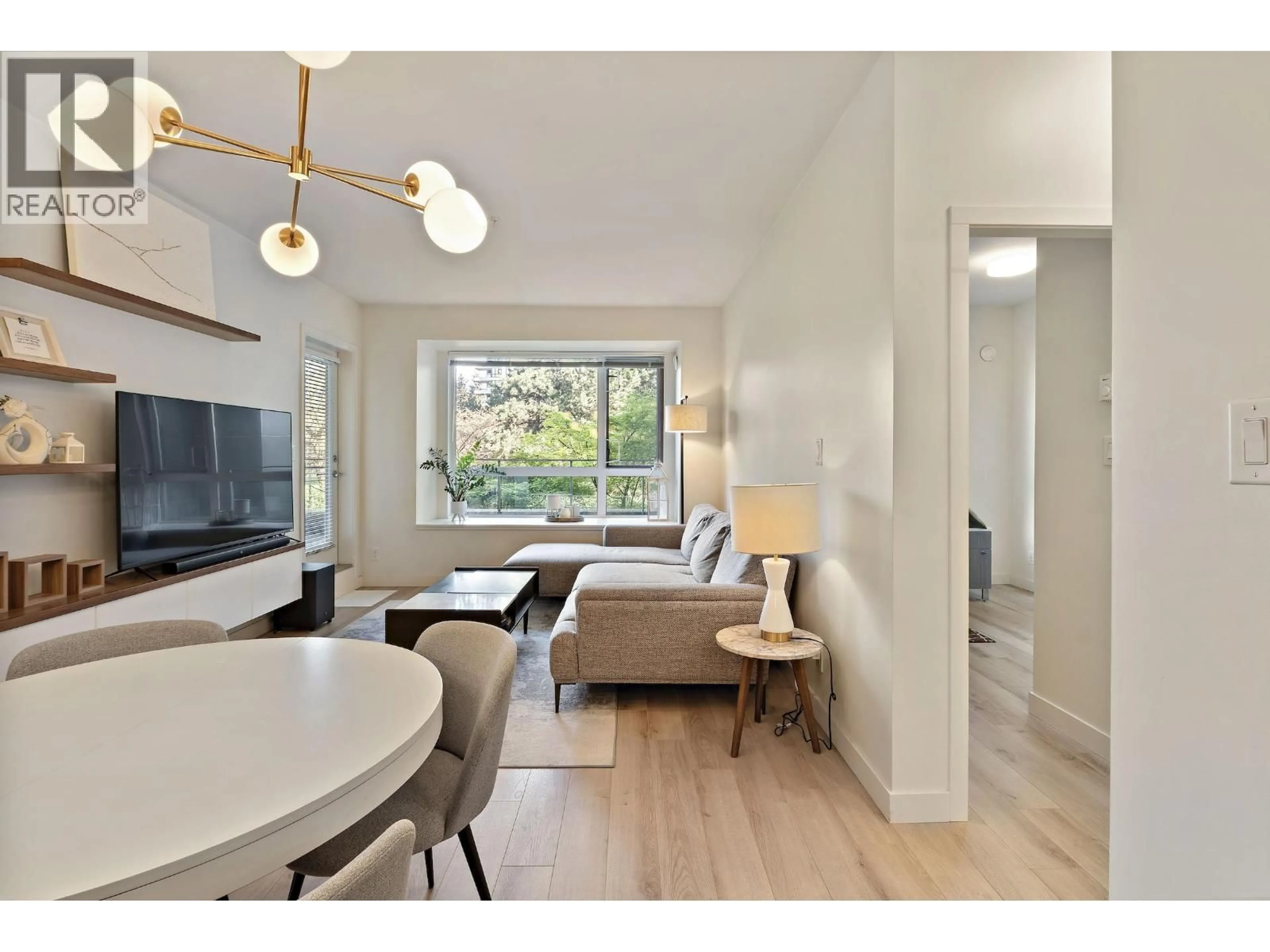 Living room with furniture, wood/laminate floor for 214 - 2188 MADISON AVENUE, Burnaby British Columbia V5C0J8