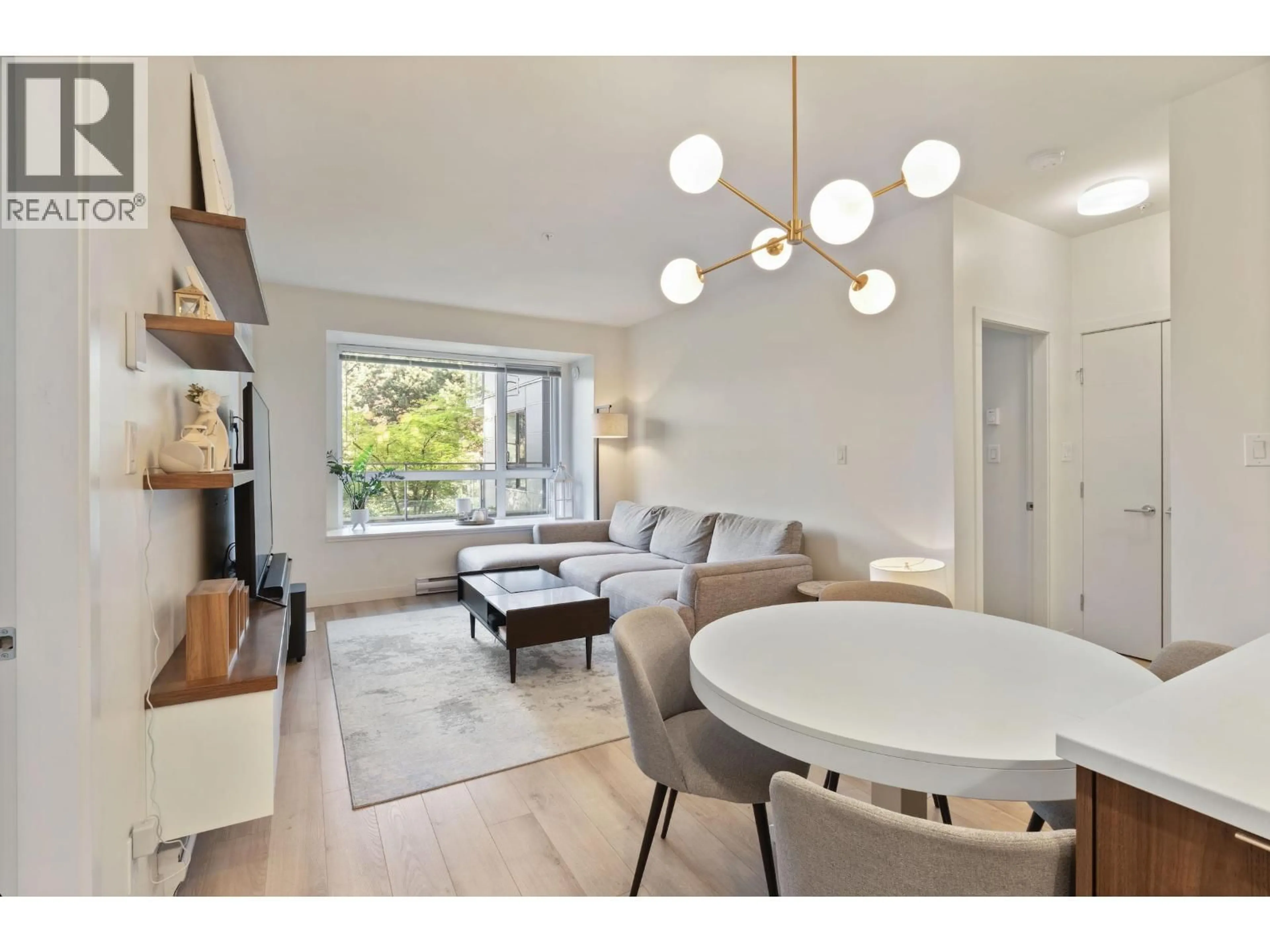 Living room with furniture, wood/laminate floor for 214 - 2188 MADISON AVENUE, Burnaby British Columbia V5C0J8