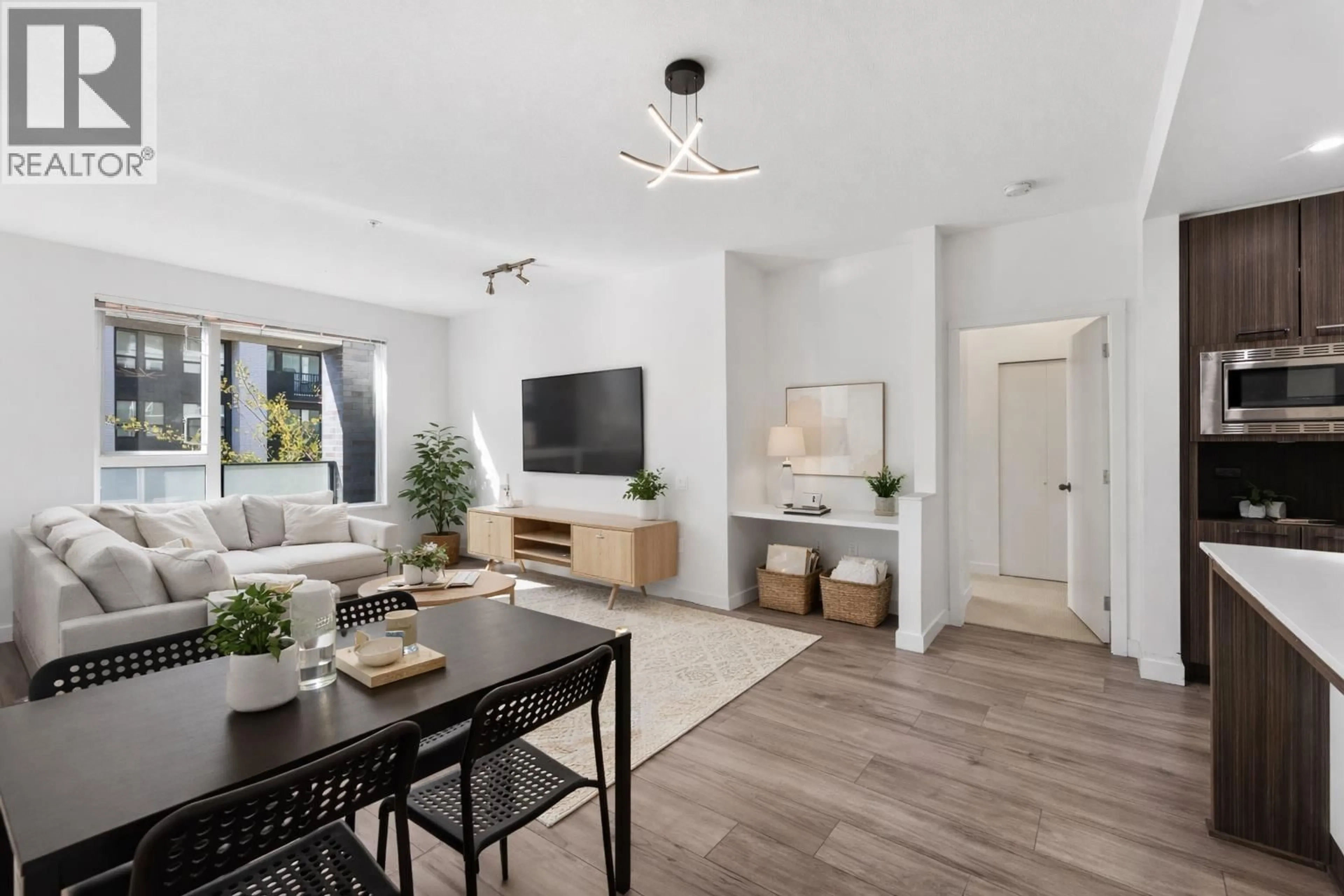 Living room with furniture, unknown for 209 - 9250 UNIVERSITY HIGH STREET, Burnaby British Columbia V5A0B3