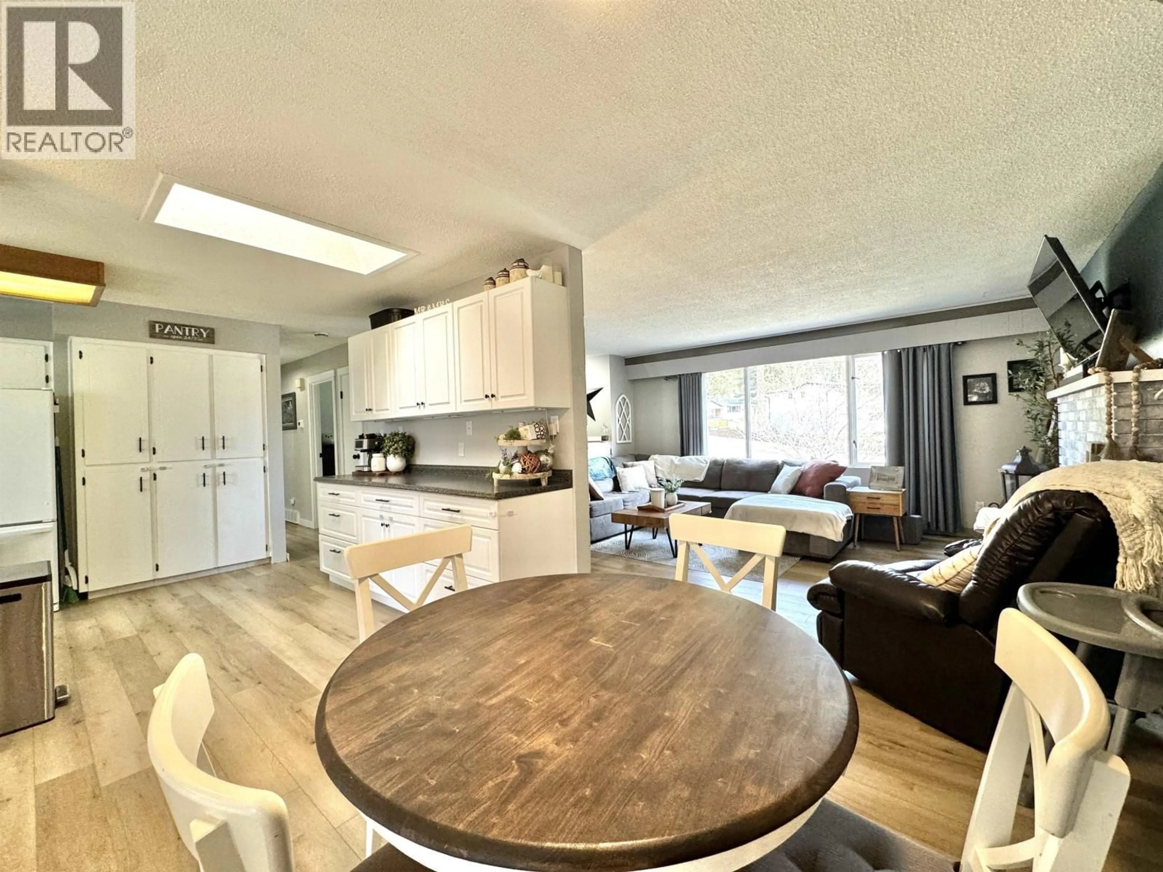 Open concept kitchen, wood/laminate floor for 1175 PIGEON AVENUE, Williams Lake British Columbia V2G2C2