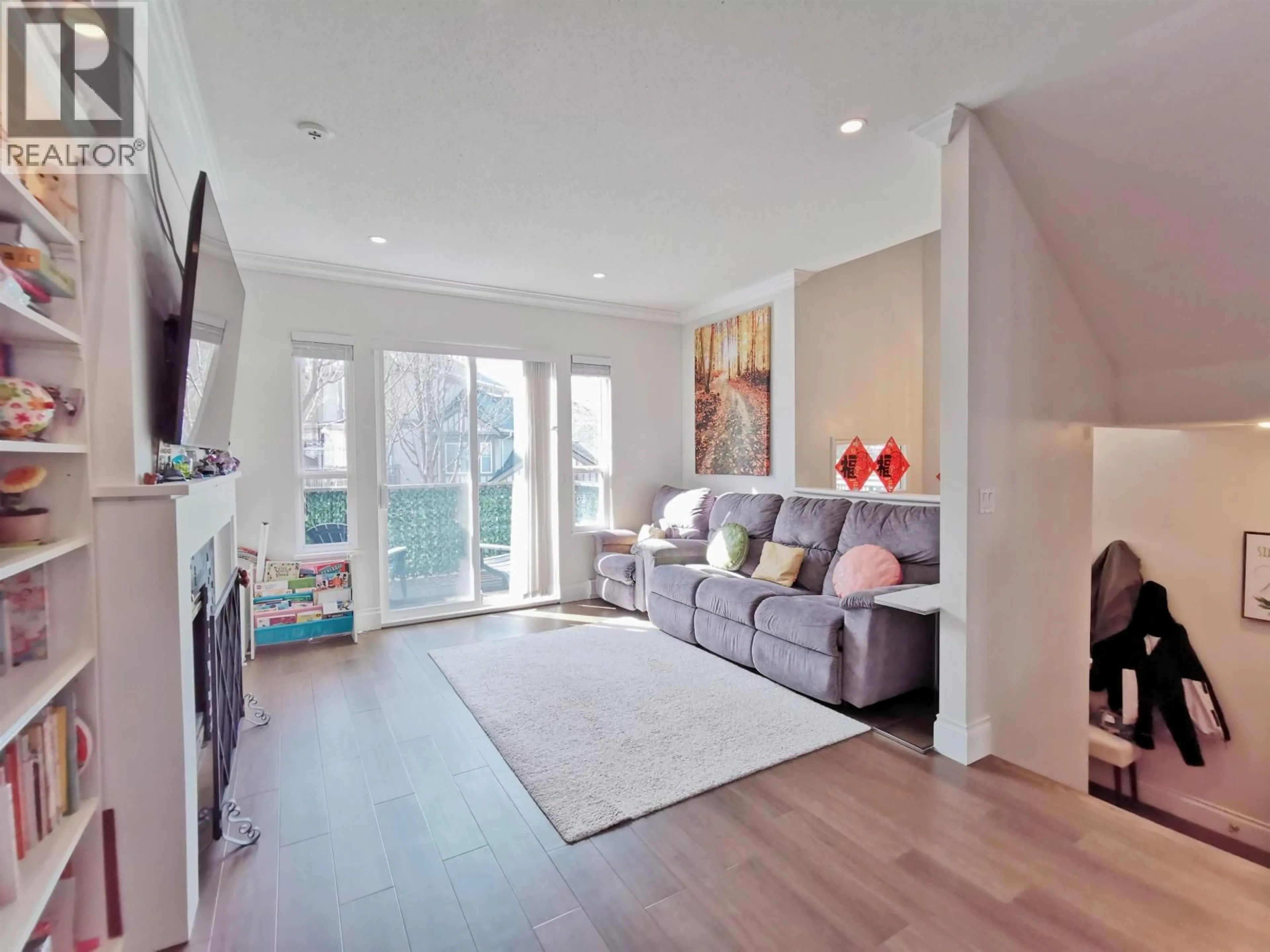 Living room with furniture, wood/laminate floor for 103 - 3880 WESTMINSTER HIGHWAY, Richmond British Columbia V7C5S1