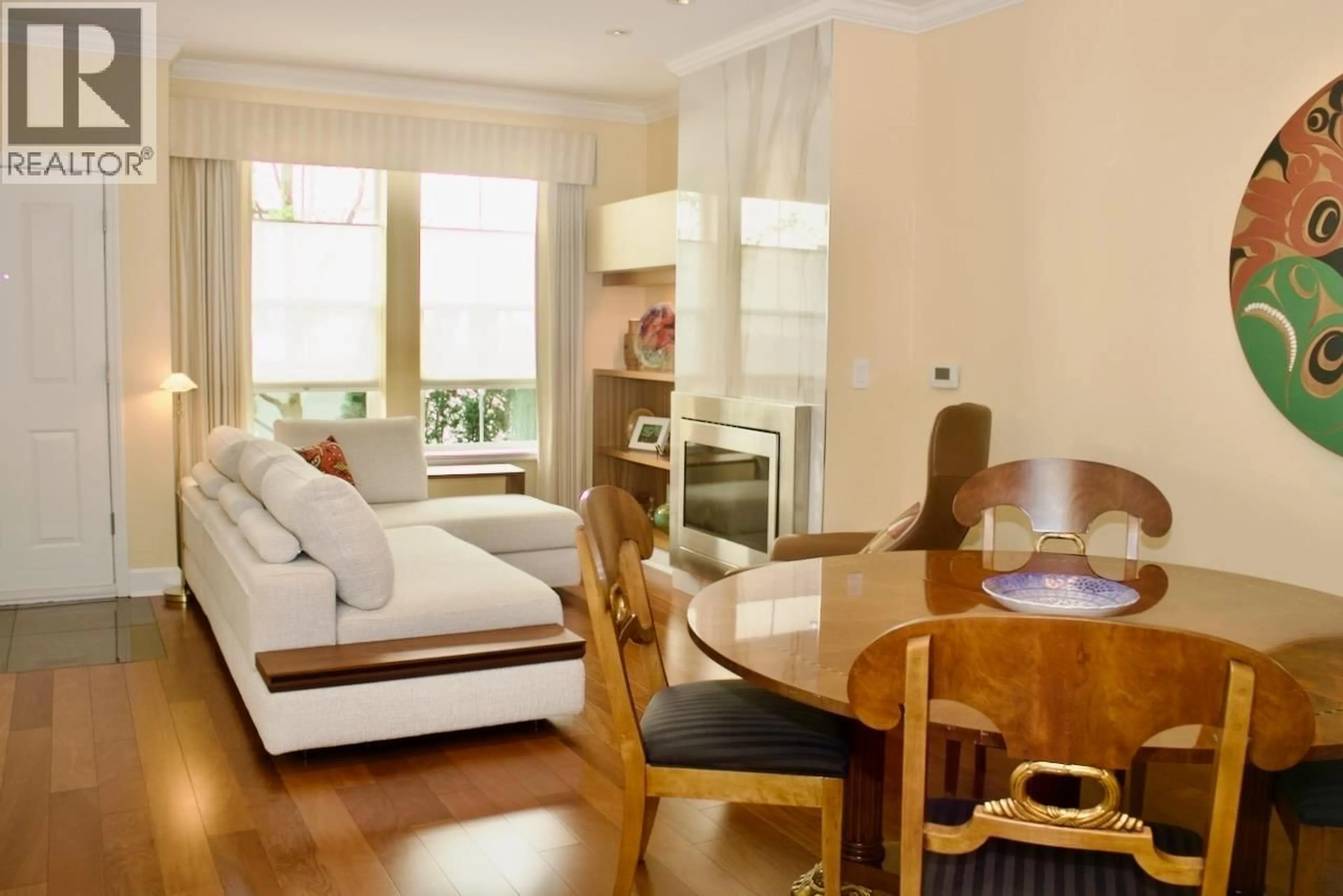 Living room with furniture, wood/laminate floor for 1934 HARO STREET, Vancouver British Columbia V6G1H6