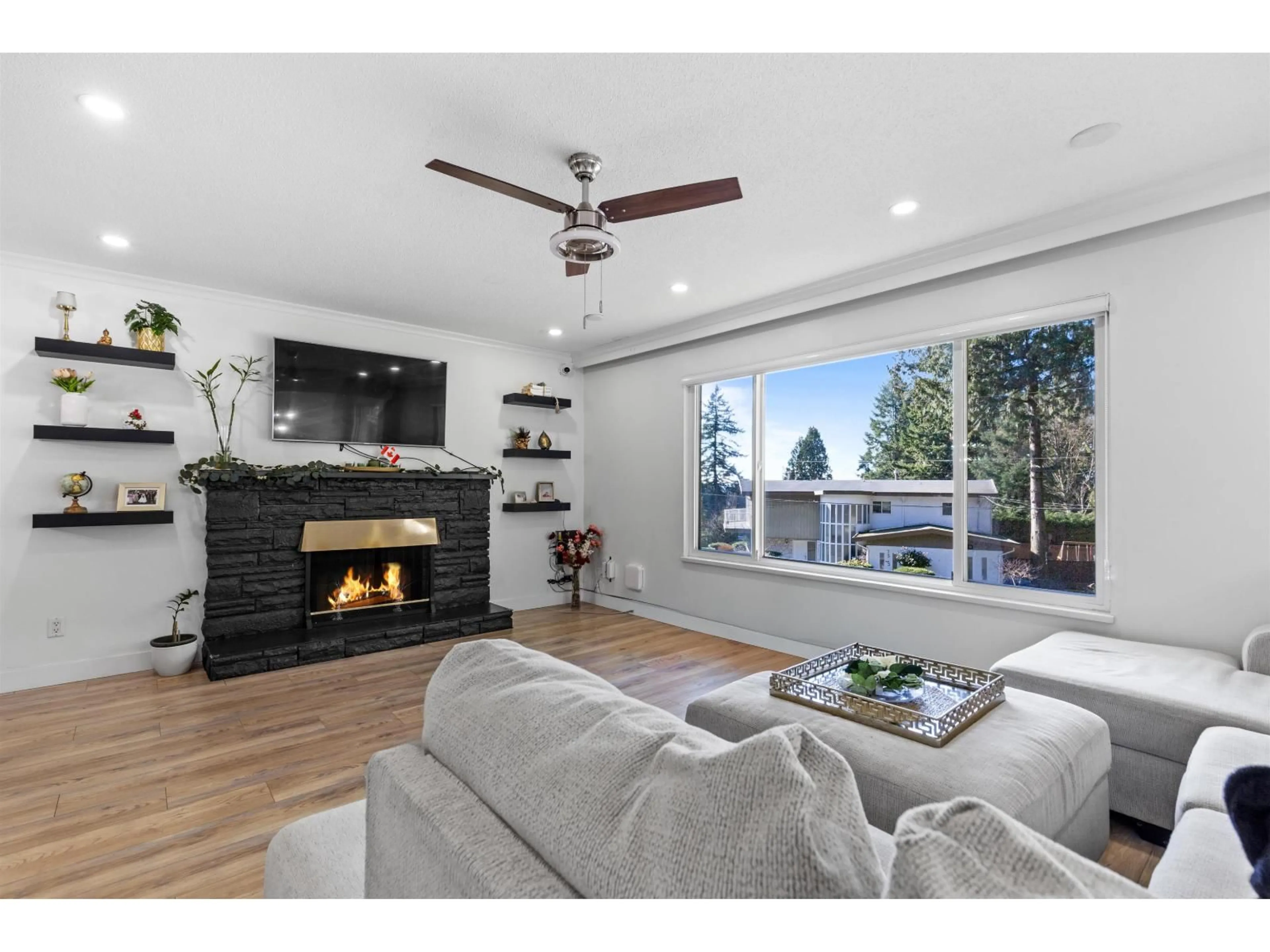 Living room with furniture, wood/laminate floor for 7334 111A STREET, Delta British Columbia V4C4S1