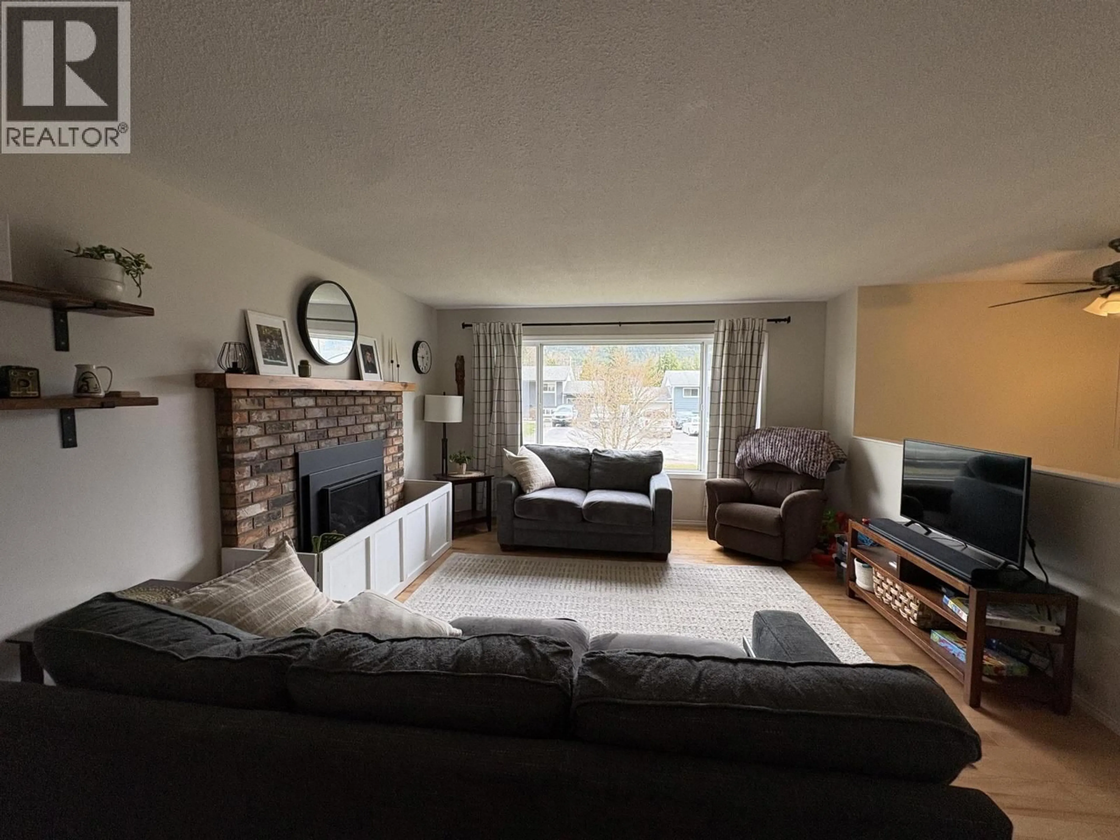 Living room with furniture, wood/laminate floor for 4017 BENNER STREET, Terrace British Columbia V8G3B1