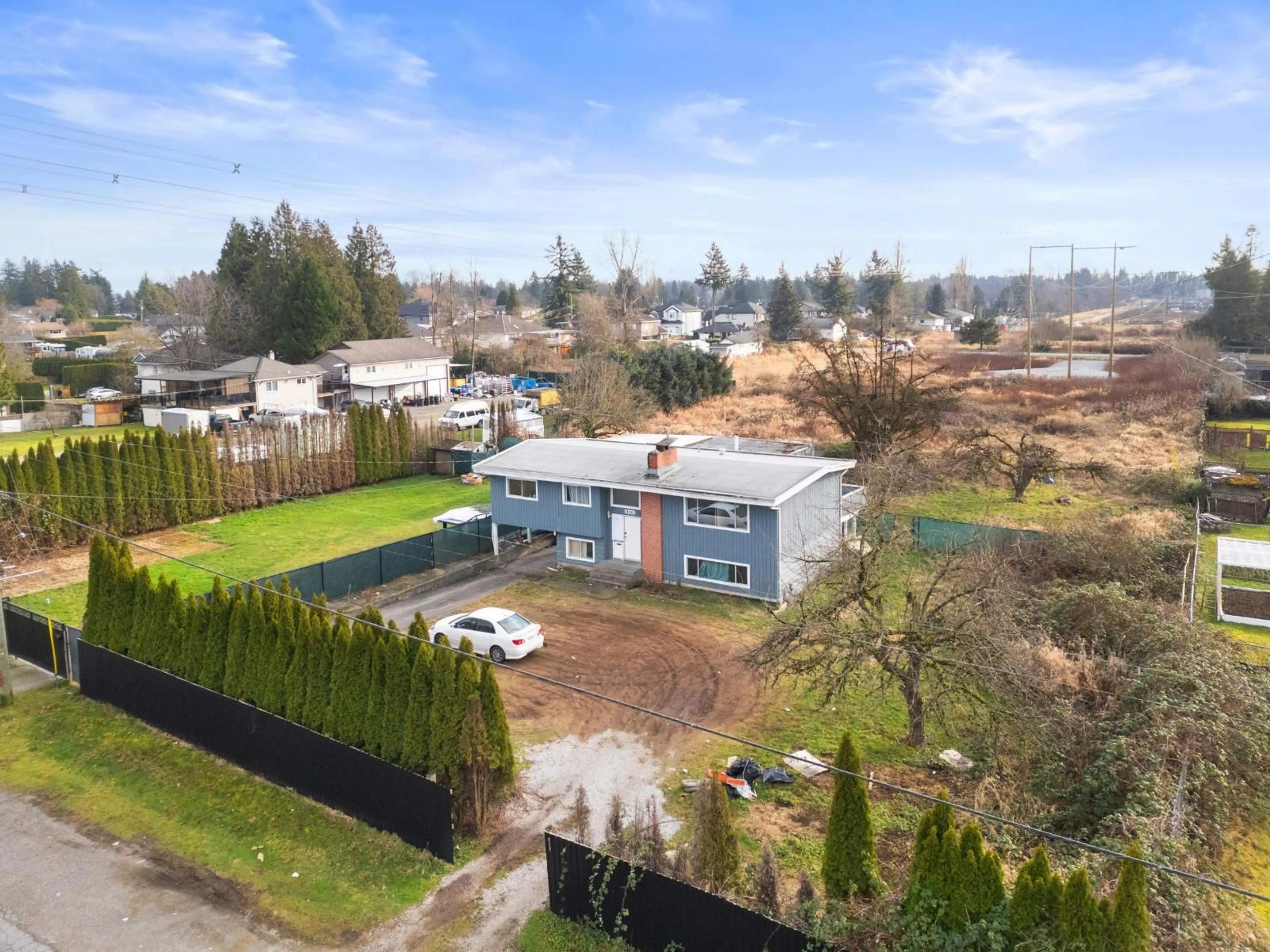 A pic from outside/outdoor area/front of a property/back of a property/a pic from drone, building for 14042 110 AVENUE, Surrey British Columbia V3R1Z2
