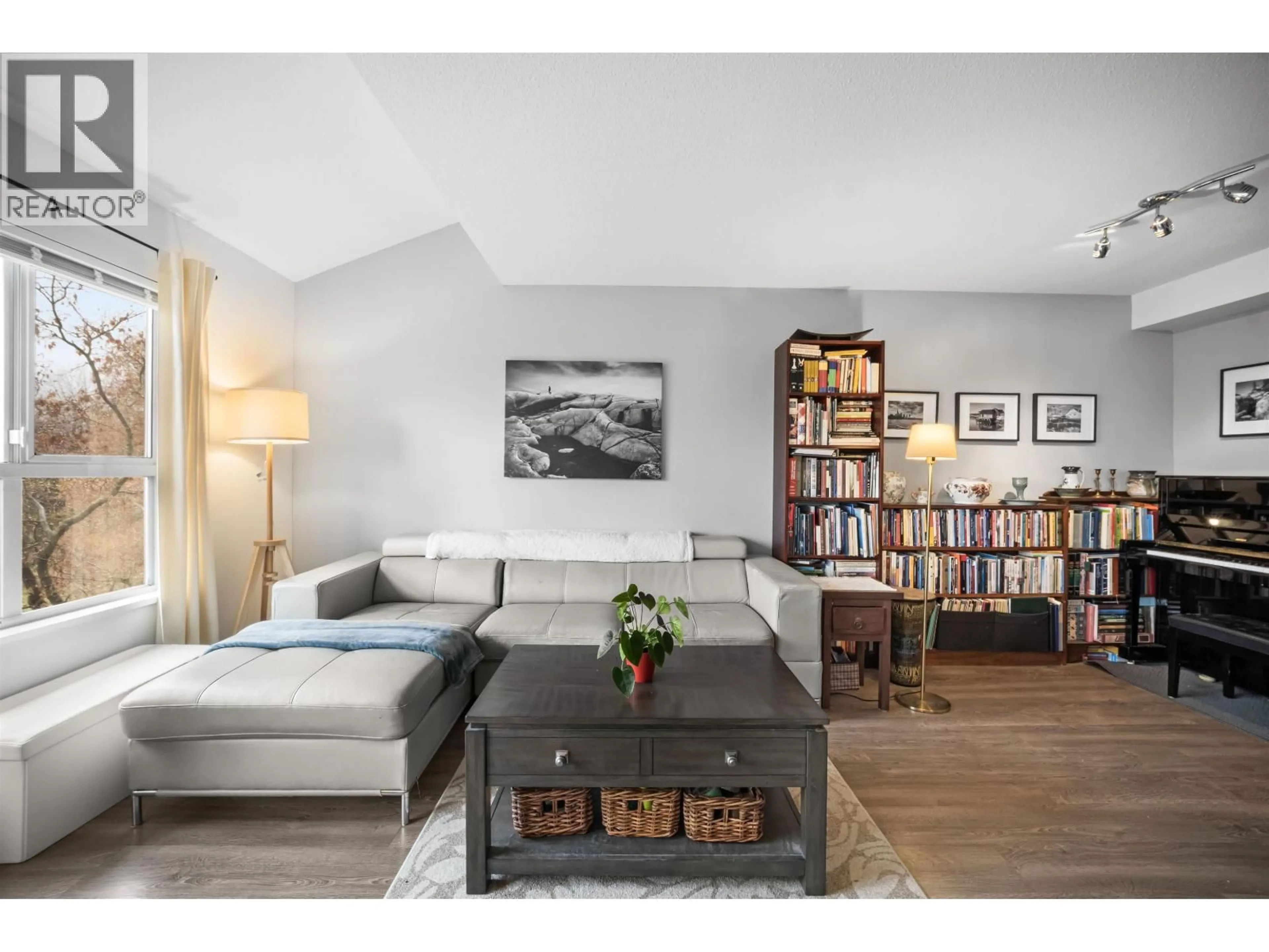 Living room with furniture, wood/laminate floor for 1145 O'FLAHERTY GATE, Port Coquitlam British Columbia V3C6H2